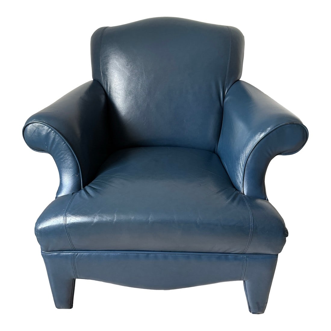 1990's Mid Century Donghia Navy Blue Leather Club Chair: Upholstered legs, an elongated seat, and sleek, pleatless arm welting. With its neotraditional styling, this piece beautifully bridges the gap between classic and contemporary. "• Seat Height: