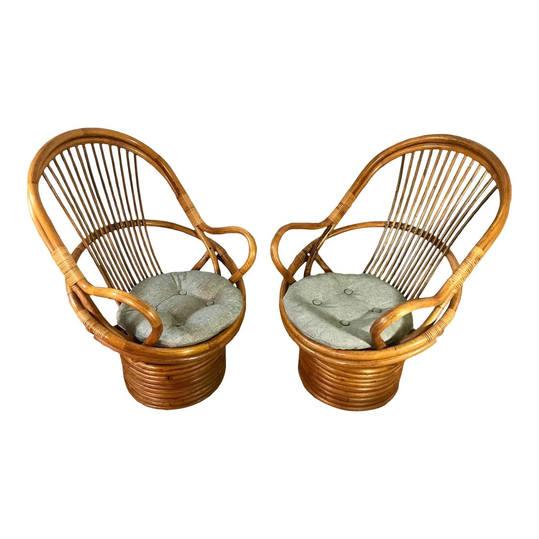 Vintage Paul Frankl Style Bamboo Rattan Swivel Chairs - Set of 2: Chic and stylish 1970's bamboo rattan chairs with the original glossy sheen in the style of Paul Frankl, circa the 1970s. Handcrafted from natural rattan, these egg-shaped chairs embrace a barrel