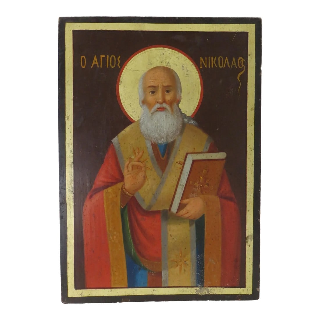 Circa 1900 Russian Icon Painting of St. Nicoli: An unusual painted Russian icon of St. Nicoli on wood. It is unusual in that on the rear are writings in five different Baltic languages of the people and dates that they owned the piece beginning in