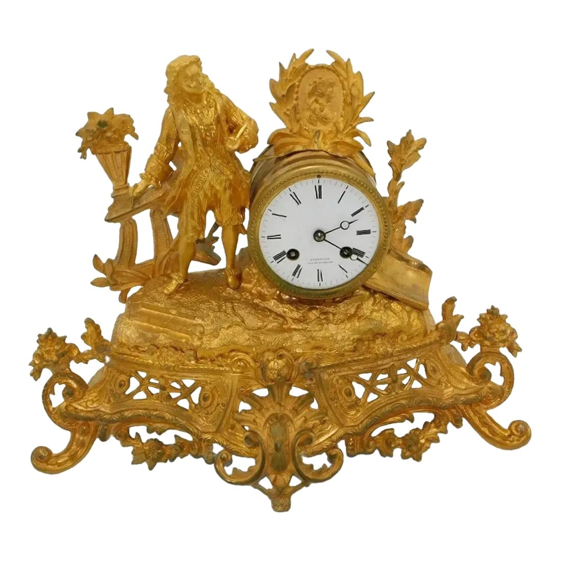 Early 19th Century Pasargad French Decorative Mantle Clock: Gilbert Clock Company pot metal figural mantle clock. Includes the original pendulum. Measures approx. 12x14 inches. Chairish sells electronic items only with the display as the intended use. The