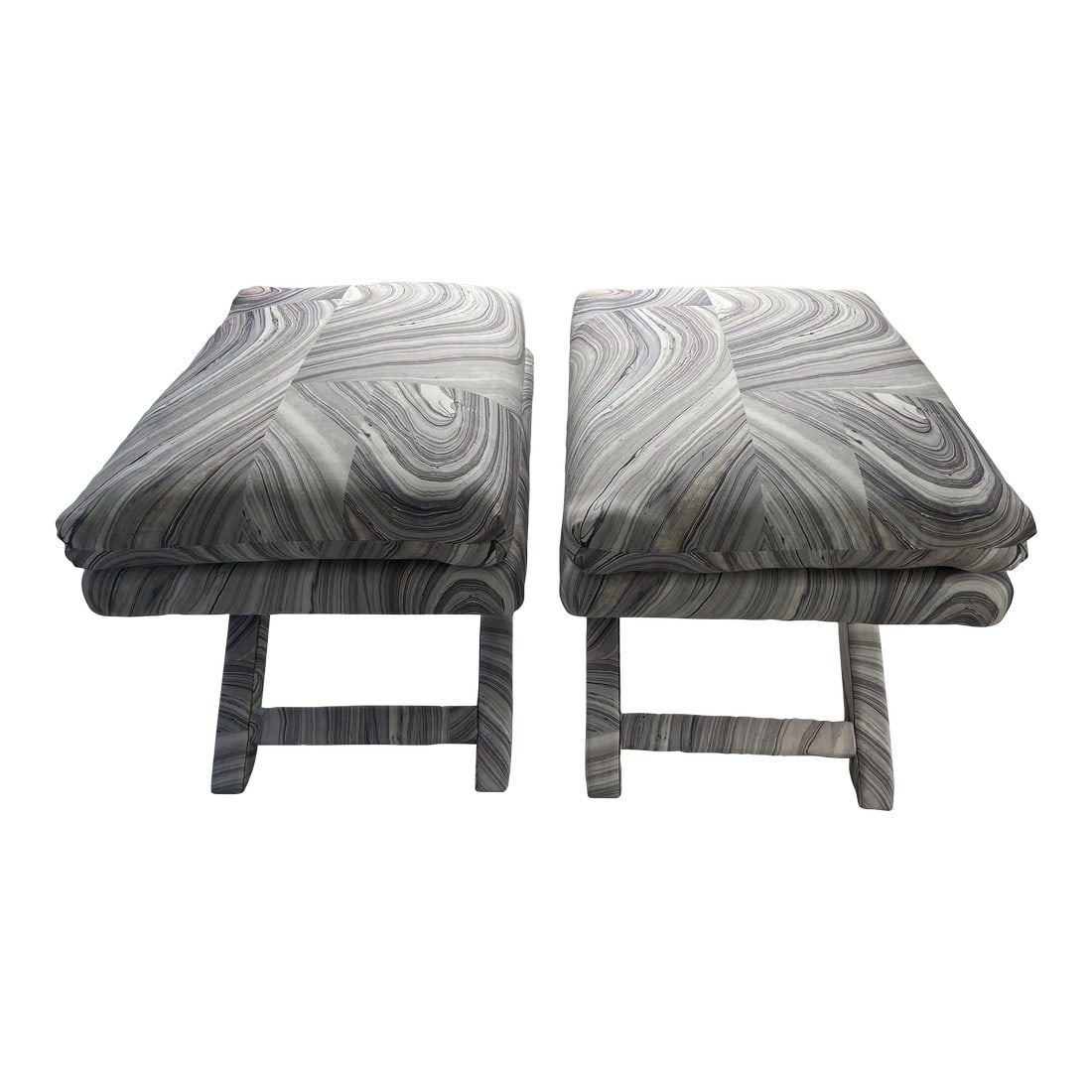 Pair of 1970's Ottomans in the Style of Billy Baldwin: A pair of Ottoman's in the style of Billy Baldwin with entirely brand new upholstery. Delicately stone patterned grey textile "Marblework" by Kravet. Modern and chic. No makers mark. Condition:
