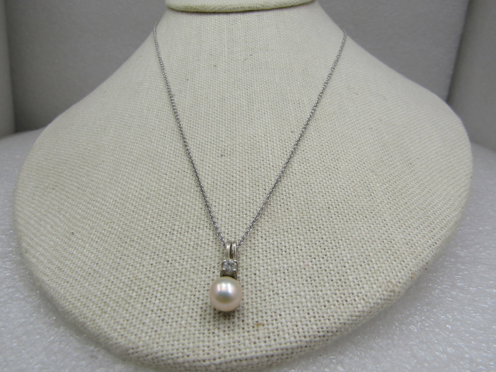 Vintage Sterling Avon Cultured Pearl Rhinestone Necklace, 18": Vintage Sterling Avon Cultured Pearl Rhinestone Necklace, 18". The pearl is a squat Tahitian style that is appx. 6mm wide with the shimmer of Tahitian pearls. Cultured pearl with a 3mm clear