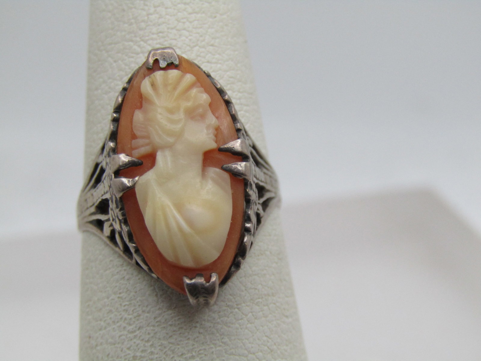 Antique Sterling Silver Carved Cameo Ring, Sz. 7. 1920's-1930's: Antique Sterling Silver Carved Cameo Ring, Sz. 7. 1920's-1930's. The ring is marked sterling and tests as sterling with a weight of appx. 2.29 gr. It is an elongated oval that is appx. 19mm down the f
