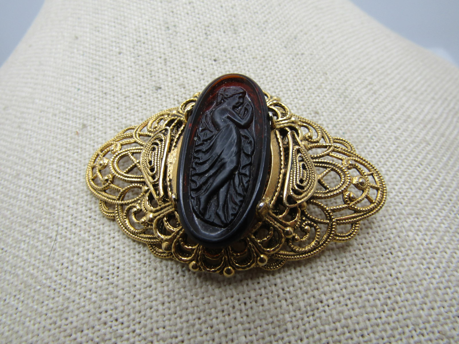 Vintage Freirich Cameo Style Brooch, 1960's, Filigree Tiered: Vintage Freirich Cameo Style Brooch, 1960's, Filigree Tiered. This has a wide base of scrolled filigree open work with a second tier that is less wide . The lower level is appx. 2-1/8" by 1.25". The s
