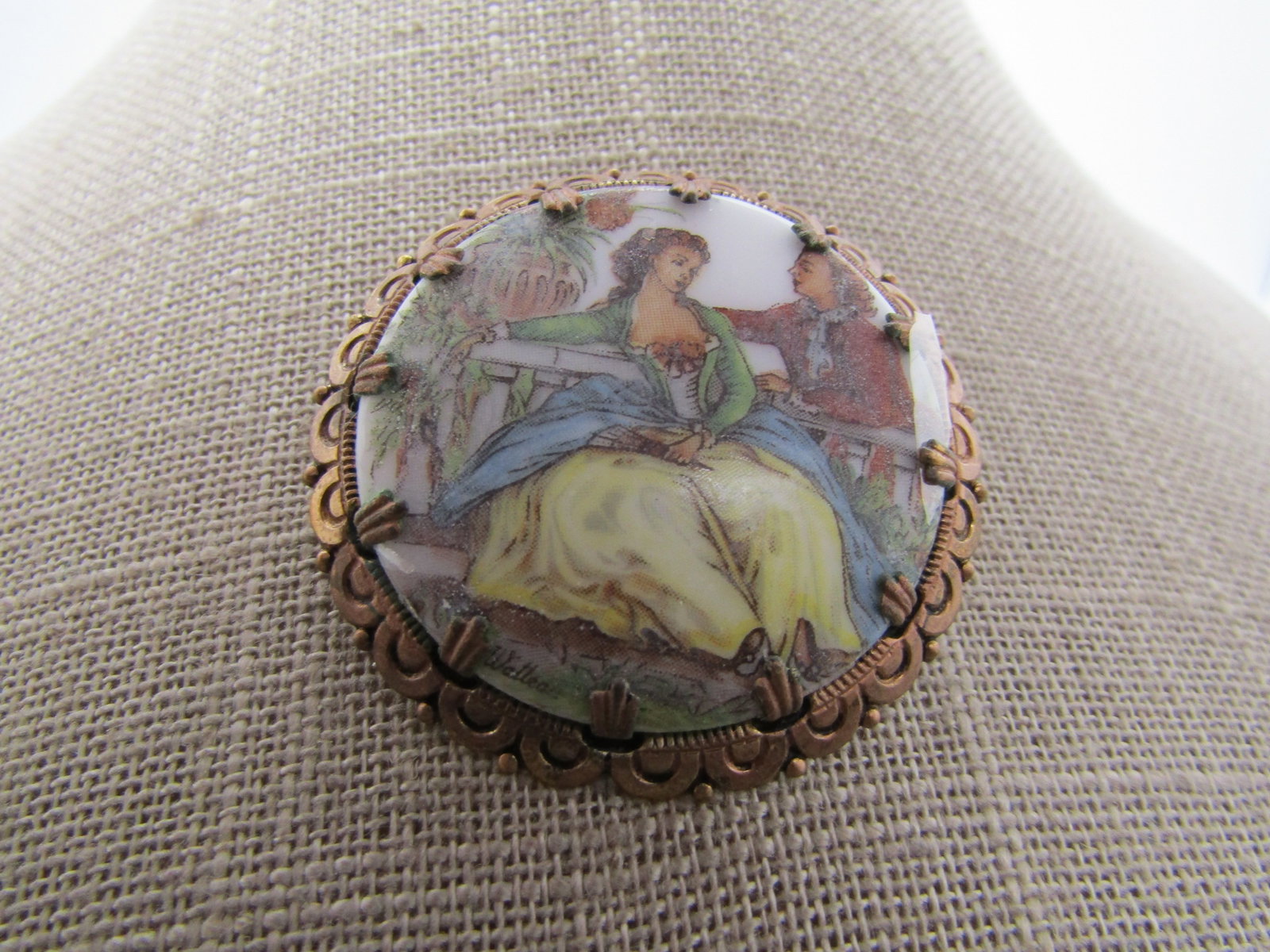 Vintage Courting Scene Brooch, West Germany, 1950's: Vintage Courting Scene Brooch, West Germany, 1950's. This has the look of a water color painting - it is a transfer as you can see under magnification. It is signed Watteau on the bottom of the scne.