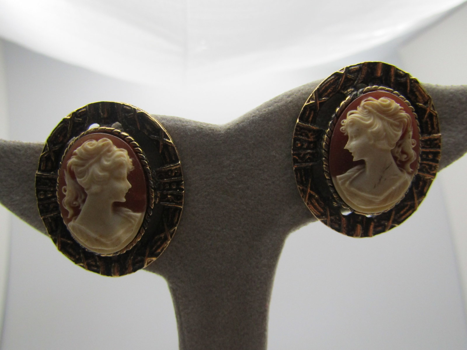 Vintage Cameo Earrings, Pierced, Gold Tone, 1970's-1980's: Vintage Cameo Earrings, Pierced, Gold Tone, 1970's-1980's. These are raised over the decorated frame of the earrings with open space between the cameo and the frame. They are appx. 1-1/8" tall and 1" 