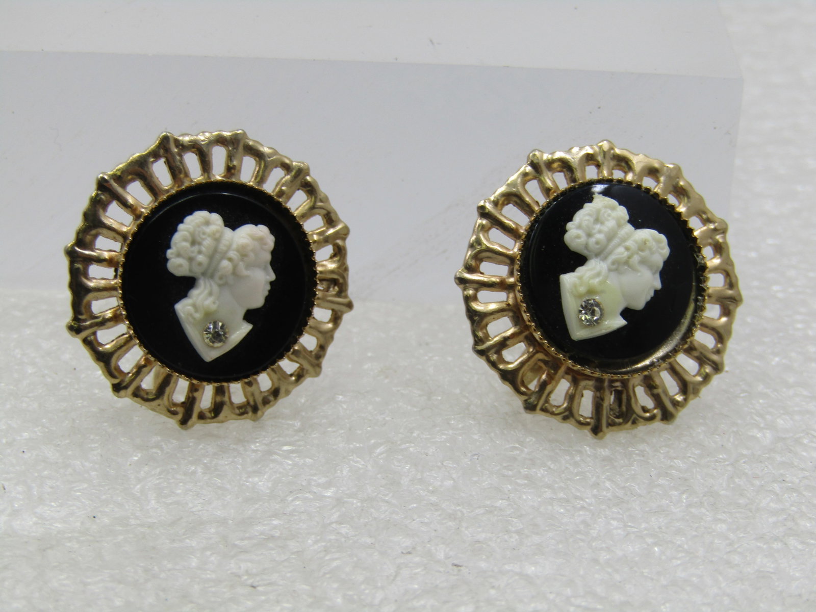 Vintage Black & White Cameo Earrings, Rhinestone, Mid-Century: Vintage Black & White Cameo Screwback Earrings, Rhinestone, Mid-Century. These have an open filigree frame around the raised bezel-set black and white cameo with a clear rhinestone at her neck as