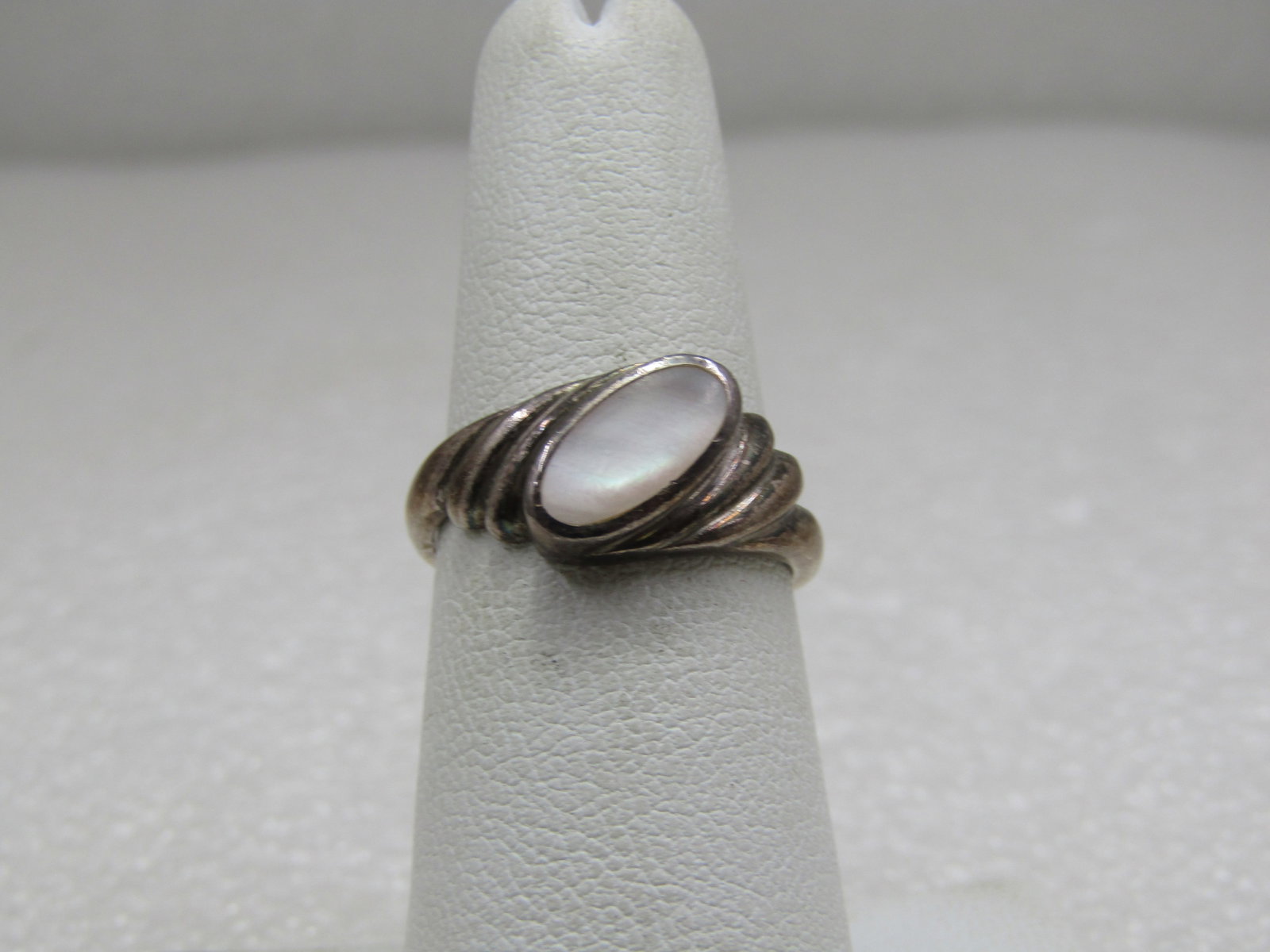 Sterling Mother of Pearl Ring, Sz. 6.5, Signed M: Sterling Mother of Pearl Ring, Sz. 6.5, Signed MA. Southwestern Appeal. Marked .925 tested and weight is apx. 3.50 gr. Very good condition. (INV. W. 11621.1X3 SS157 J LEB* LD 11/13/21). Reserve: