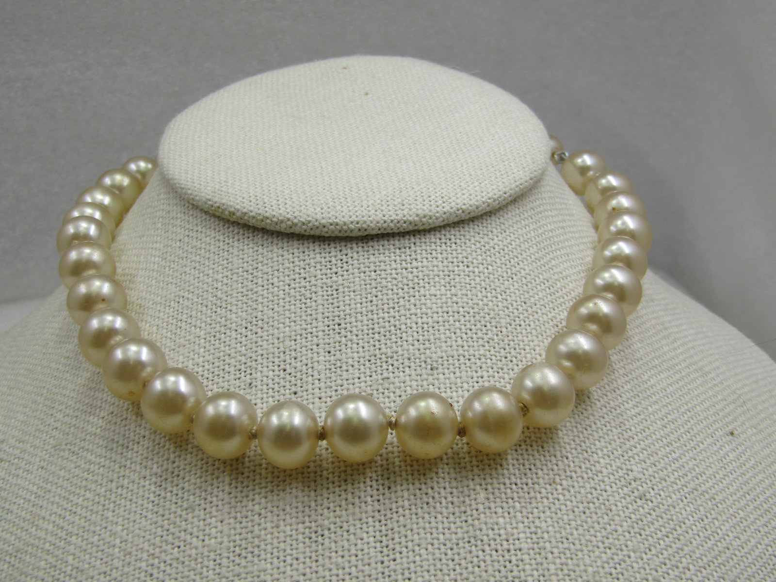 Vintage Japan Faux Pearl Necklace, 16", 9.5mm, Rhinestone: Vintage Japan Faux Pearl Necklace, 16", 9.5mm, Rhinestone hook clasp. Mid-Century. The pearls have a cream orient to them and are knotted between. They are heavy and believed to be glass with the pear