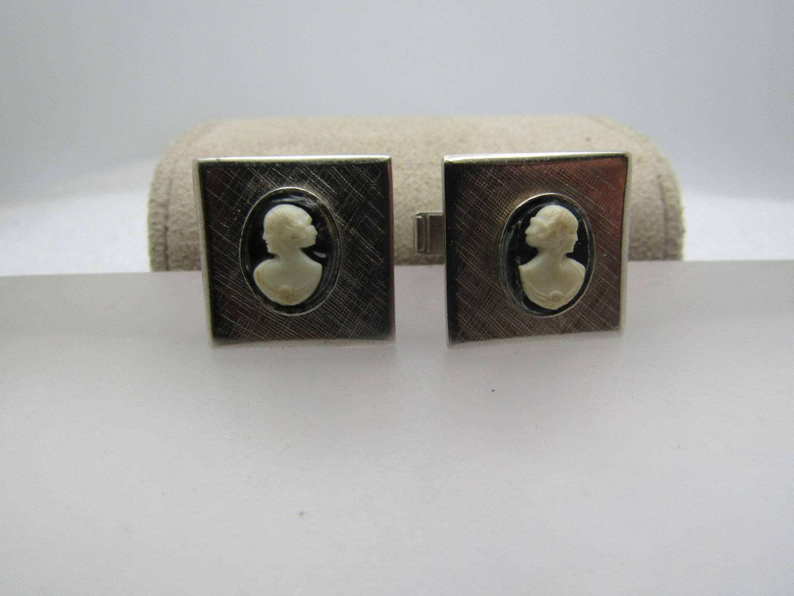 Vintage Cameo Cufflinks, 1950's-1970's: Vintage Cameo Cufflinks, 1950's-1970's. Oval black adn white cameos set over a textured square background. The cameos are plastic and papx. 19.5mmby 8.5mm. They have a whale back mechanism. They are a