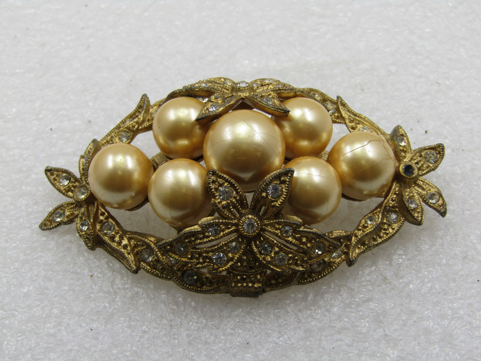 Antique Rhinestone & Faux Pearl Art Deco Brooch, 1920's, 2-7/8": Antique Rhinestone & Faux Pearl Art Deco Brooch, 1920's, 2-7/8" wide and 1-5/8" tall. This is a stunning brooch that is 100 years old with tan faux pearls in the center of this brooch in a domed clust