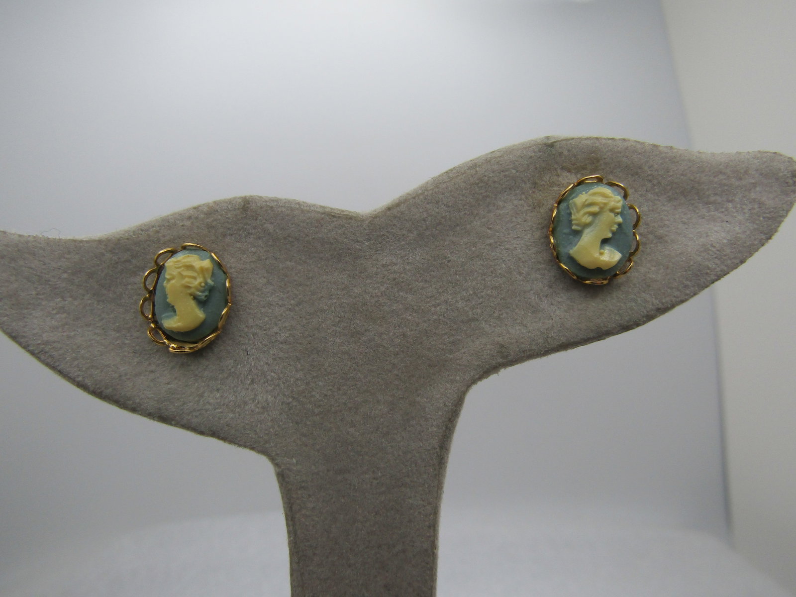 Vintage Faux Wedgood Cameo Earrings, Green, 1960's: Vintage Faux Wedgood Cameo Earrings, Green, 1960's. They are appx. 1/2" tall and 1/3" wide in an open scalloped bezel. They are not marked or signed. Gold tone. Very clean and in very good condition. 