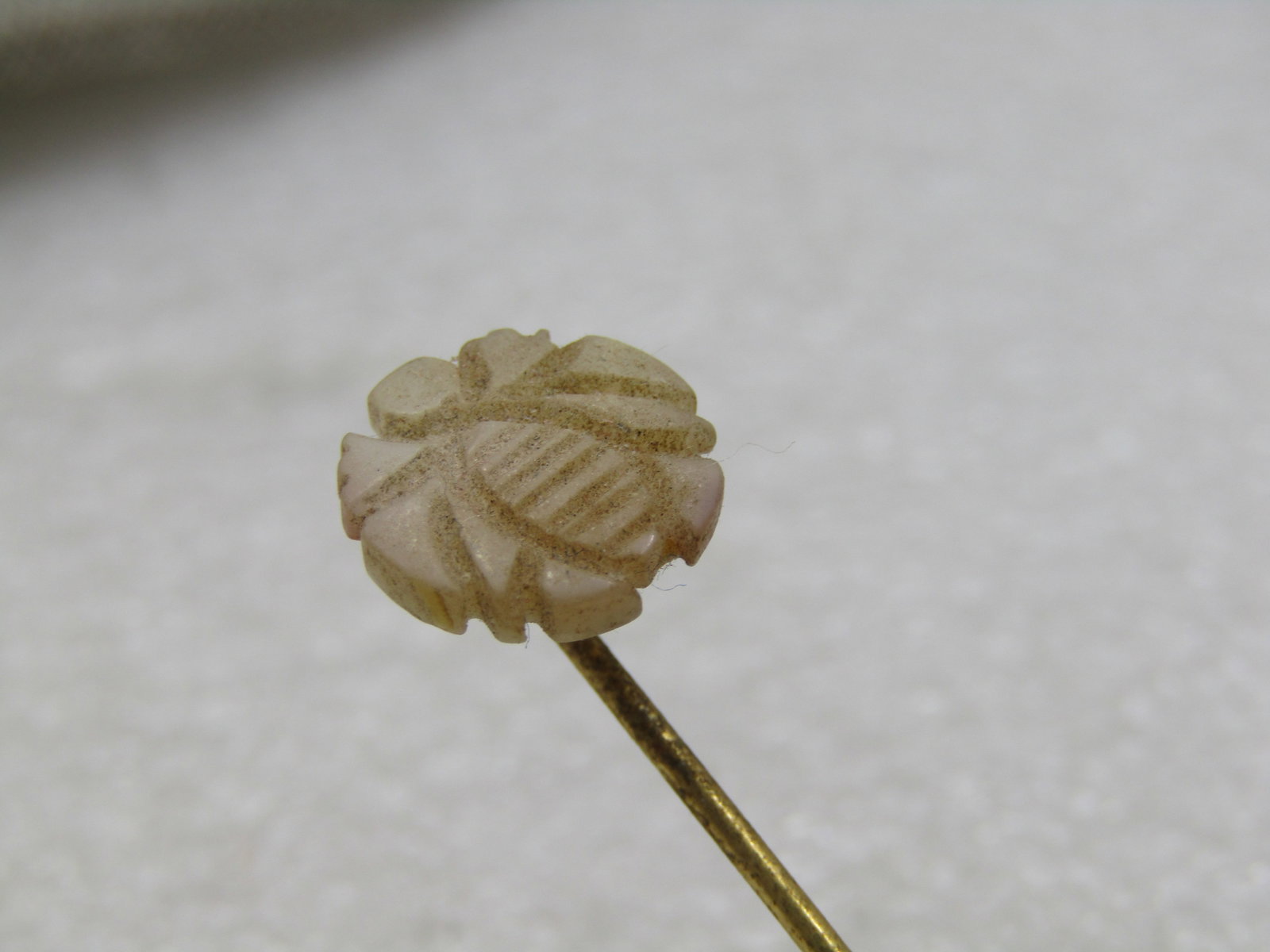 Vintage Mother-of-Pearl Carved Bee Stick Pin, 3": Vintage Mother-of-Pearl Carved Bee Stick Pin, 3". The bee is round and appx. 1/2" across. With safety cap. The pin is gold tone. Pre mid-century but exact age not known. Not signed by the maker. Very