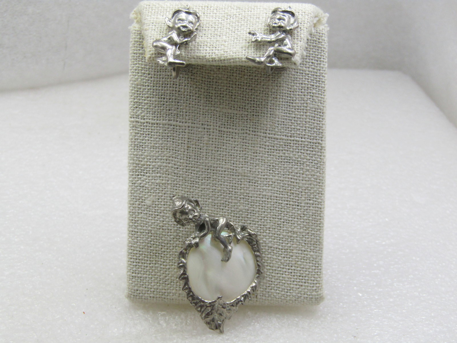 Vintage Mother of Pearl Pixie Brooch & Clip Earrings Set, Mid-Century: Vintage Mother of Pearl Pixie Brooch & Clip Earrings Set, Mid-Century. Also called Cyvra elves these little imps are very cute with their pointed caps. The brooch has an elf on top of a faux mother-of