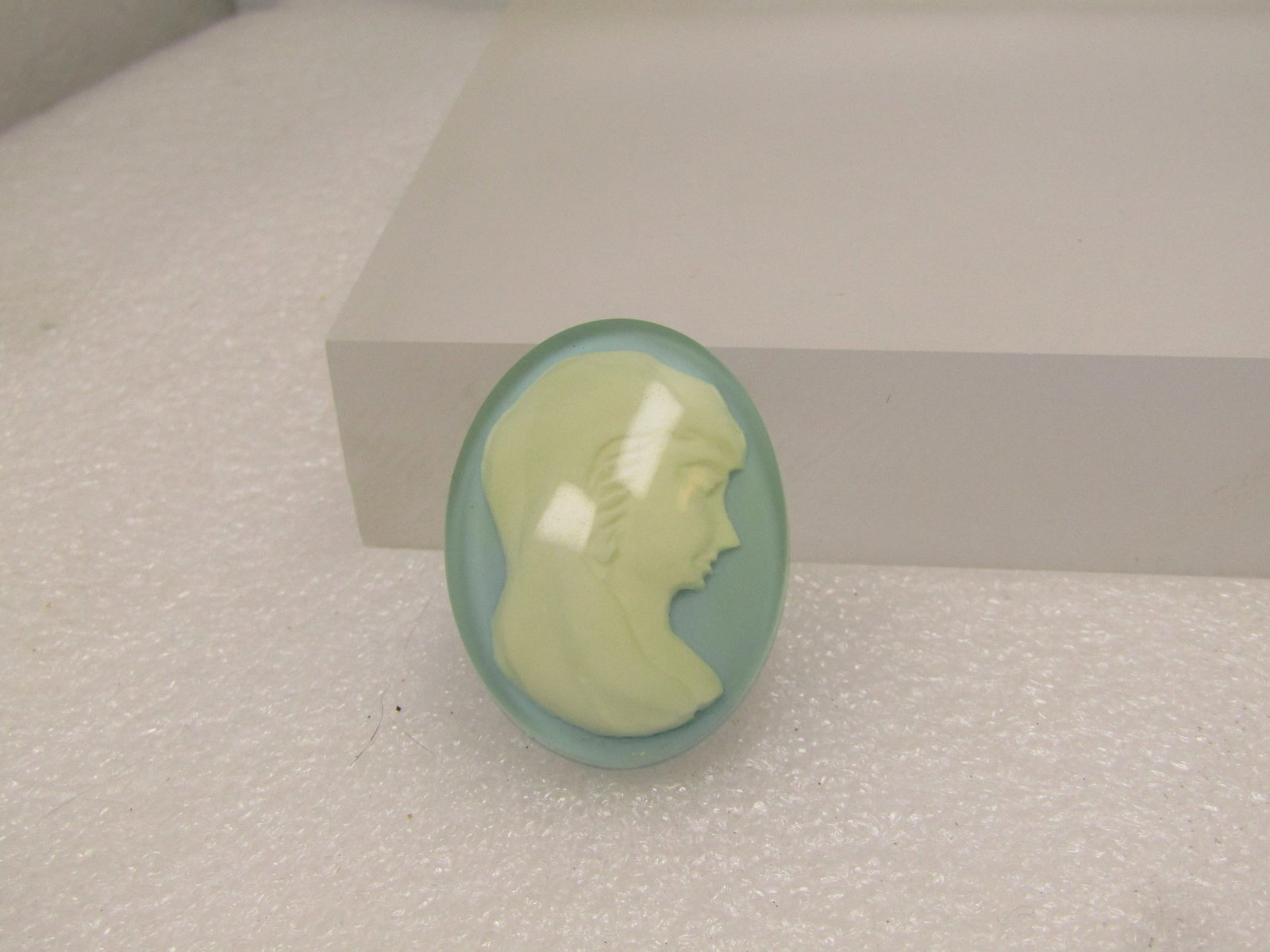 Vintage Blue/White/Clear Cameo Brooch, 1960's: Vintage Blue/White/Clear Cameo Brooch, 1960's. This is appx. 1.5" tall and 1-1/8" wide oval. It has a baby blue background with a white woman's face on the blue with a clear layer over top. It is an a