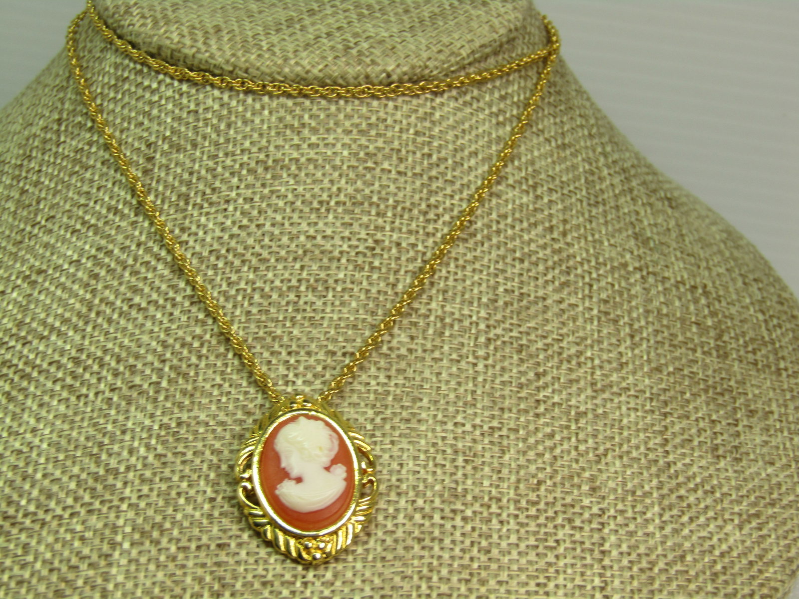 Vintage Cameo Necklace 24", Gold Tone, 1960's-1970's.: Vintage Cameo Necklace 24", Gold Tone, 1960's-1970's. This has a cameo pendant that is appx. 1.25" tall and 3/4" wide on a 2mm twisted gold tone chain with spring ring clasp. It is in excellent and
