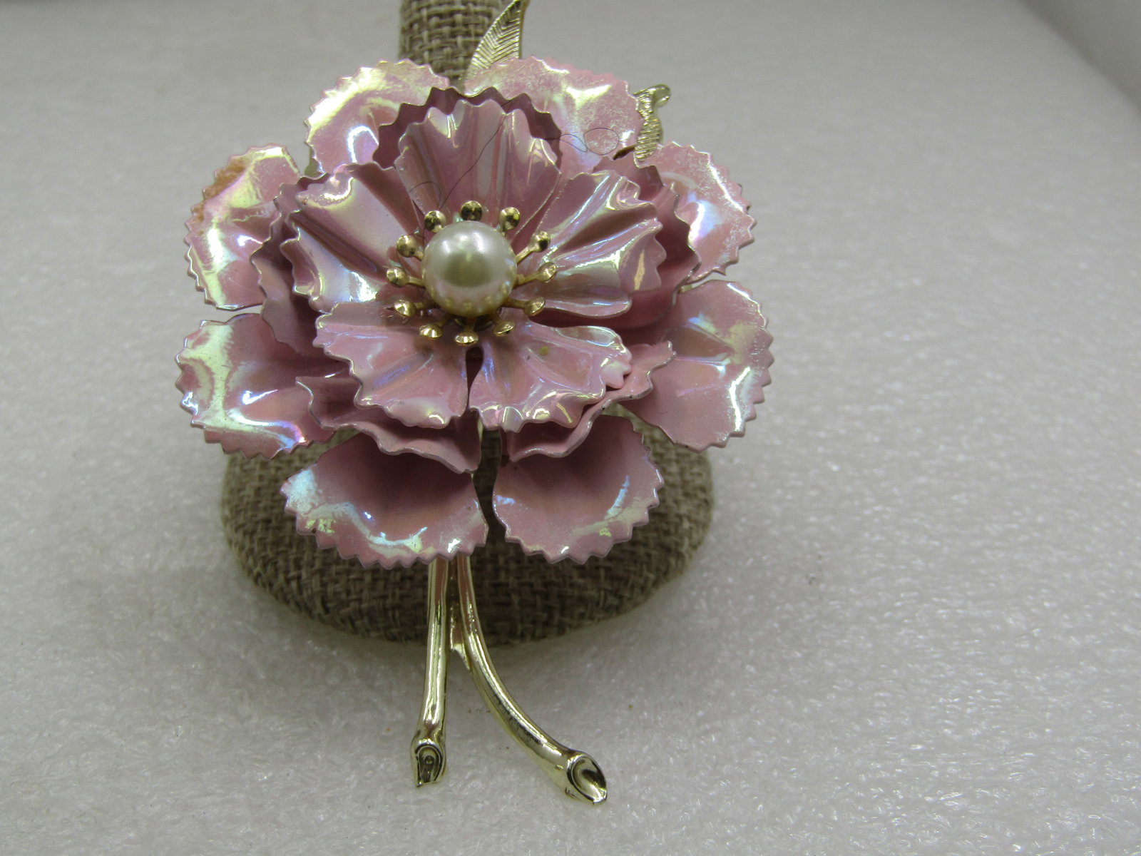 Vintage Iridescent Pink Enameled Carnation Floral Brooch, Faux Pearl, 1960's: Vintage Iridescent Pink Enameled Carnation Floral Brooch, Faux Pearl, 1960's. It is 3.25 tall with blossom and gold tone stem and textured leaves and 2.25" wide. Four tiers with iridescent pink enamel