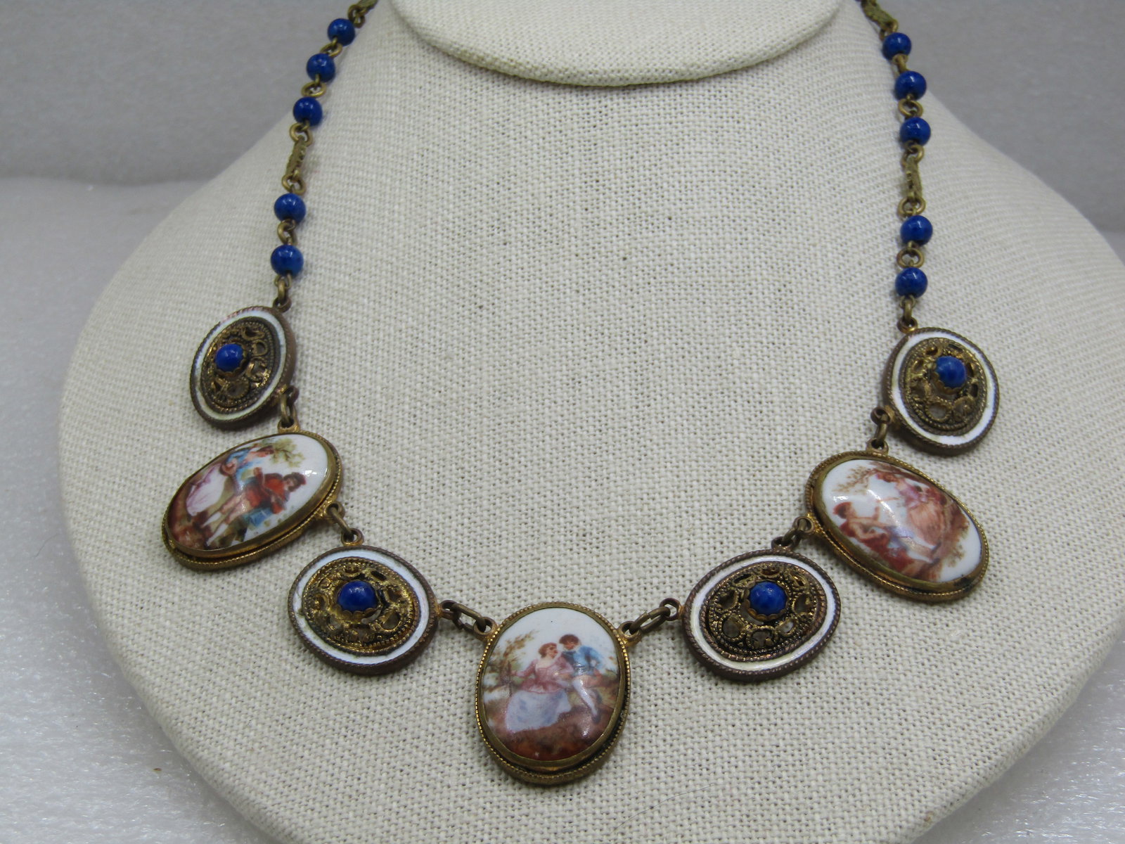 Vintage French Courting Scene Multi-Cameo Drop Necklace, 17", 1930's-1940's: Vintage French Courting Scene Multi-Cameo Drop Necklace, 17", 1930's-1940's. This has three oval french courting scenne drops, domed, that are appx. 1.25" tall and 7/8" wide with 5 filigree oval links