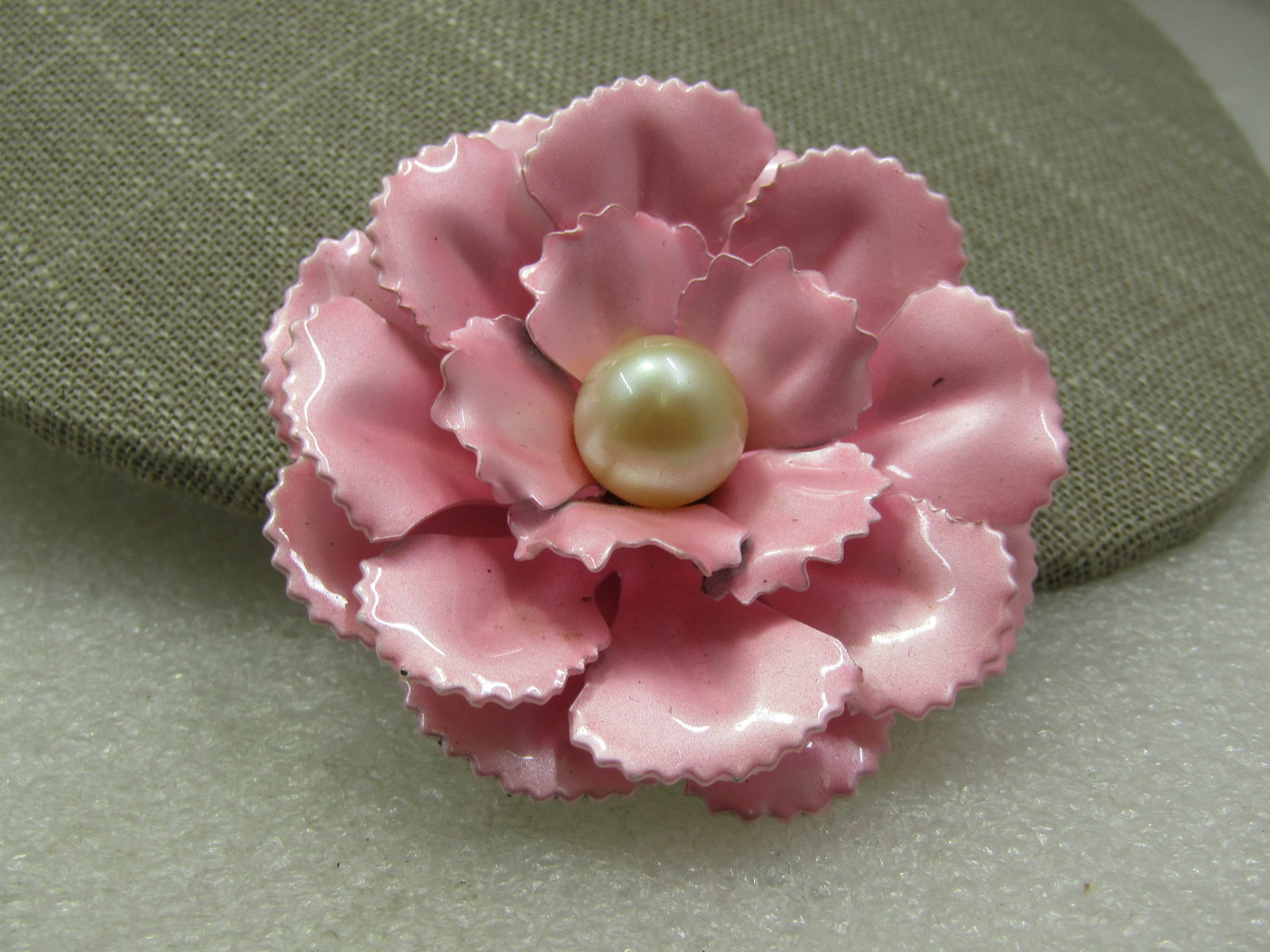 Vintage Pink Enameled Floral Brooch with Pearl, 2.25", 1960's: Vintage Pink Enameled Floral Brooch with Pearl, 2.25", 1960's. Faux appz. 12mm pearl in the center with three lvels of carnation type petals. Not signed by the maker. Very good condition. (INV. W. 214