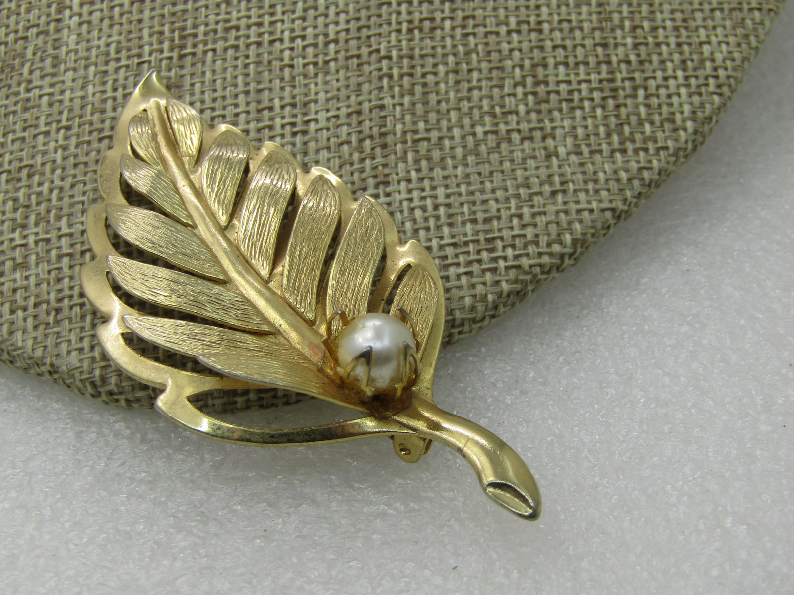 Vintage Leaf With Faux Pearl Brooch, 1960's, 3": Vintage Leaf With Faux Pearl Brooch, 1960's, 3" by 1.5". Parts of the leaf are raised with open space under them, textured finish and also smooth and shiny edges and vein and sstem. Not signed by the 