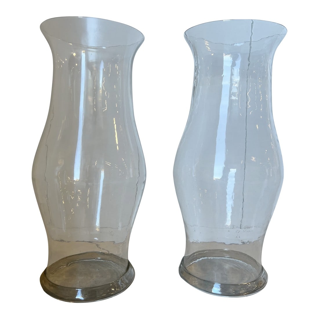 Pair, Monumental 19th Century American Blown Glass Hurricane Candle Shades 22.5": American, mid 19th century. A pair of monumental blown glass hurricane shades in colorless glass. Each with tapering form and folded foot rims. Provenance: From a Little Compton Rhode Island Estate.