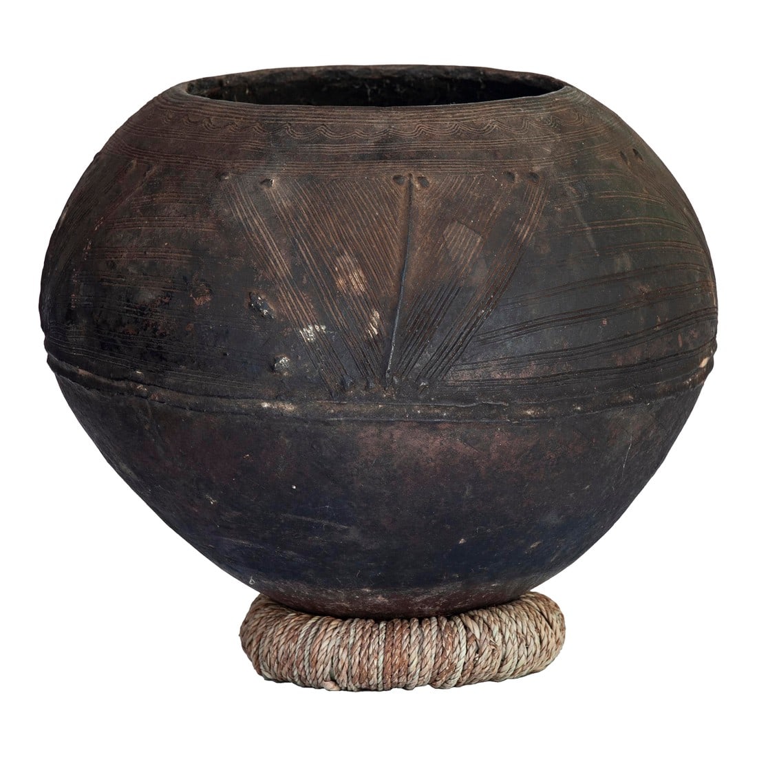 Antique African Clay Pot With Rattan Base: This Beautiful Earthy, Dark Brown/Black Clay Pot is Handcrafted by Mossi tribe; of Nigeria. These vessels are crafted in various shapes and sizes to store grains or water. Mossi pottery vessels are
