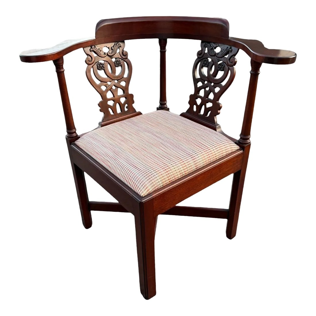 Mid 20th Century Chippendale Corner Chair: Quick Hits: - Mid-20th century Chippendale corner chair - Classic mahogany finish with intricate carved backrest - Unique corner design perfect for tight spaces - Ideal for living rooms, studies, or
