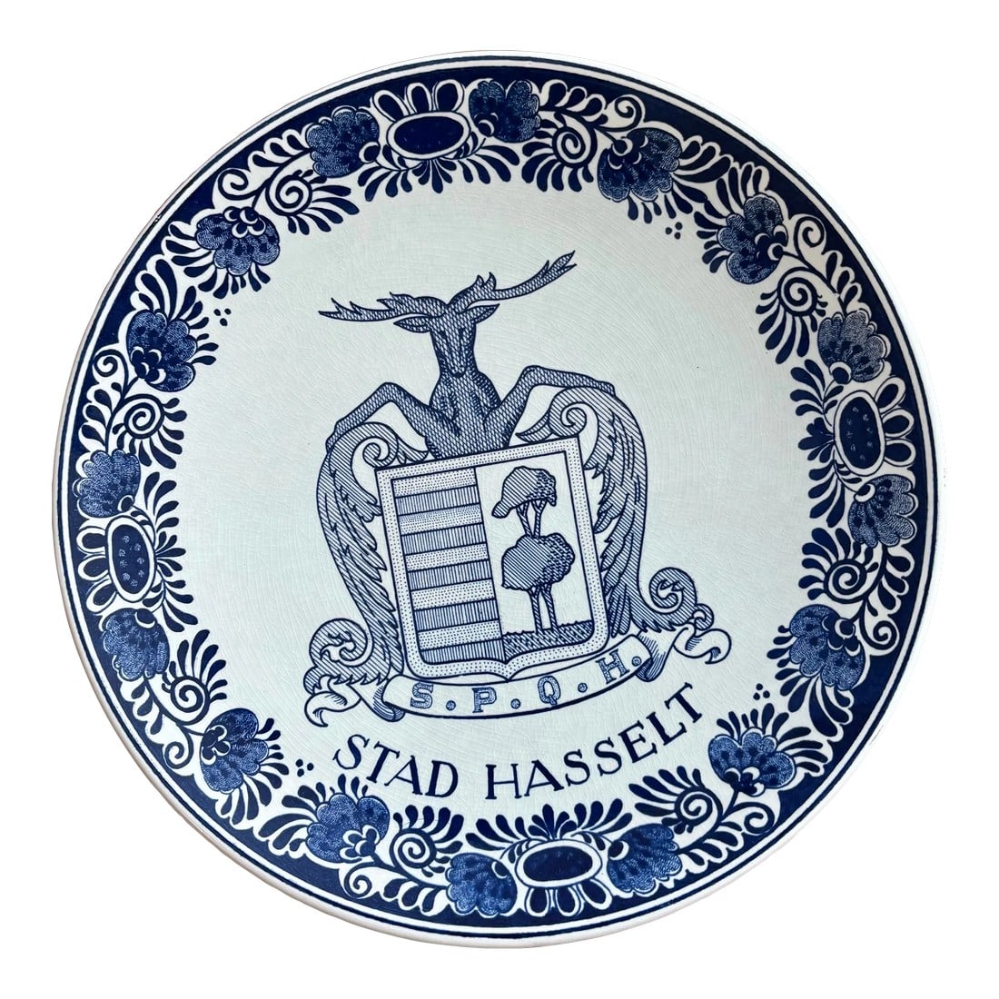 Mid 20th Century Dutch Delft Deer Coat of Arms Plate: Rare Dutch Delft coat of arms wall plate, featuring a deer holding two acanthus leaves above a ribbon with the letters S.P.Q.H, a Latin abbreviation translated "for the Government and the People of
