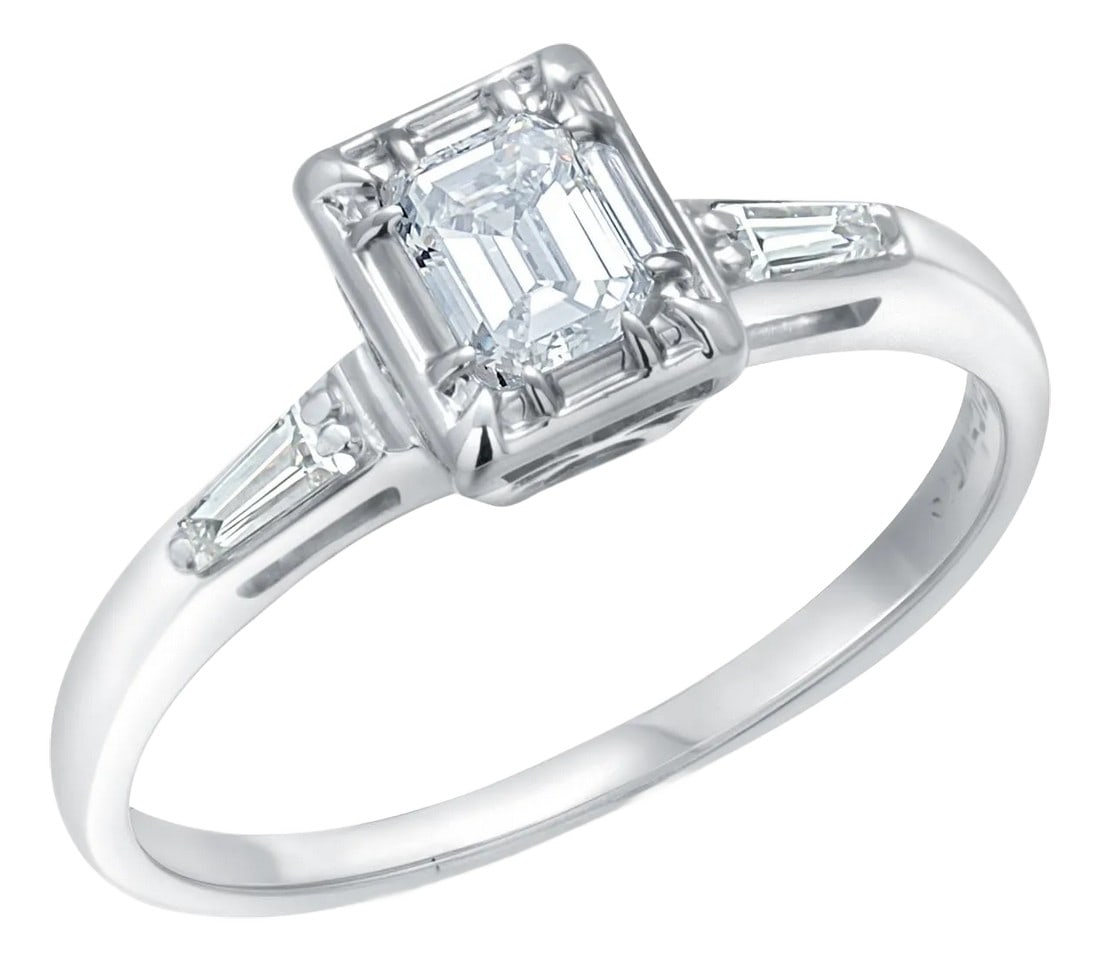 14 Karat Gold Diamond Engagement Ring Emerald-Cut Diamond and Baguette Accent Size 6: Stunning 14k Gold Diamond Engagement Ring with Emerald-Cut Center Diamond and Baguette Accents Description: Elevate your love story with this exquisite 14k gold diamond engagement ring, featuring a