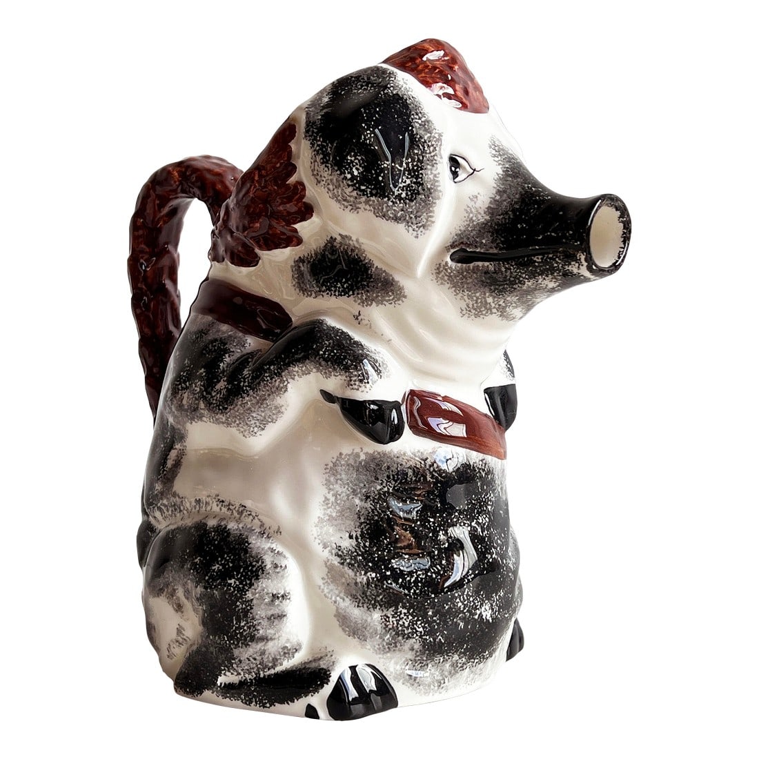 Vintage Italian Majolica Pig Pitcher: This whimsical Italian majolica pitcher captures the charm of rustic ceramic artistry with its playful pig form and expressive hand-painted glaze. Finished in a tactile black and white spongeware