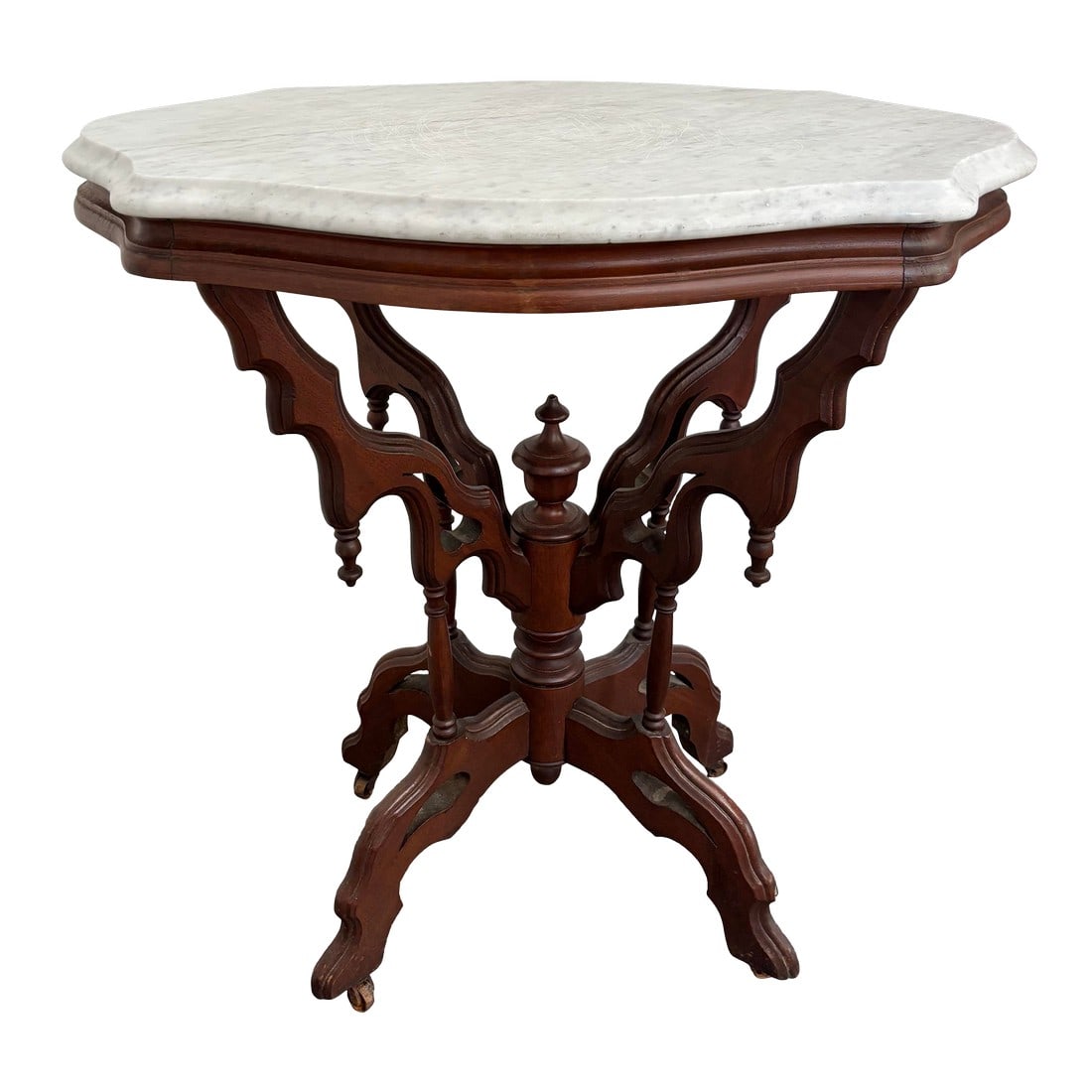 1800s Victorian Carved Mahogany Marble Top Table on Casters: Early to mid 1800s Victorian marble top table on casters, with white marble top and solid mahogany base. Please see condition details noted. Please see condition details noted, which include surface s