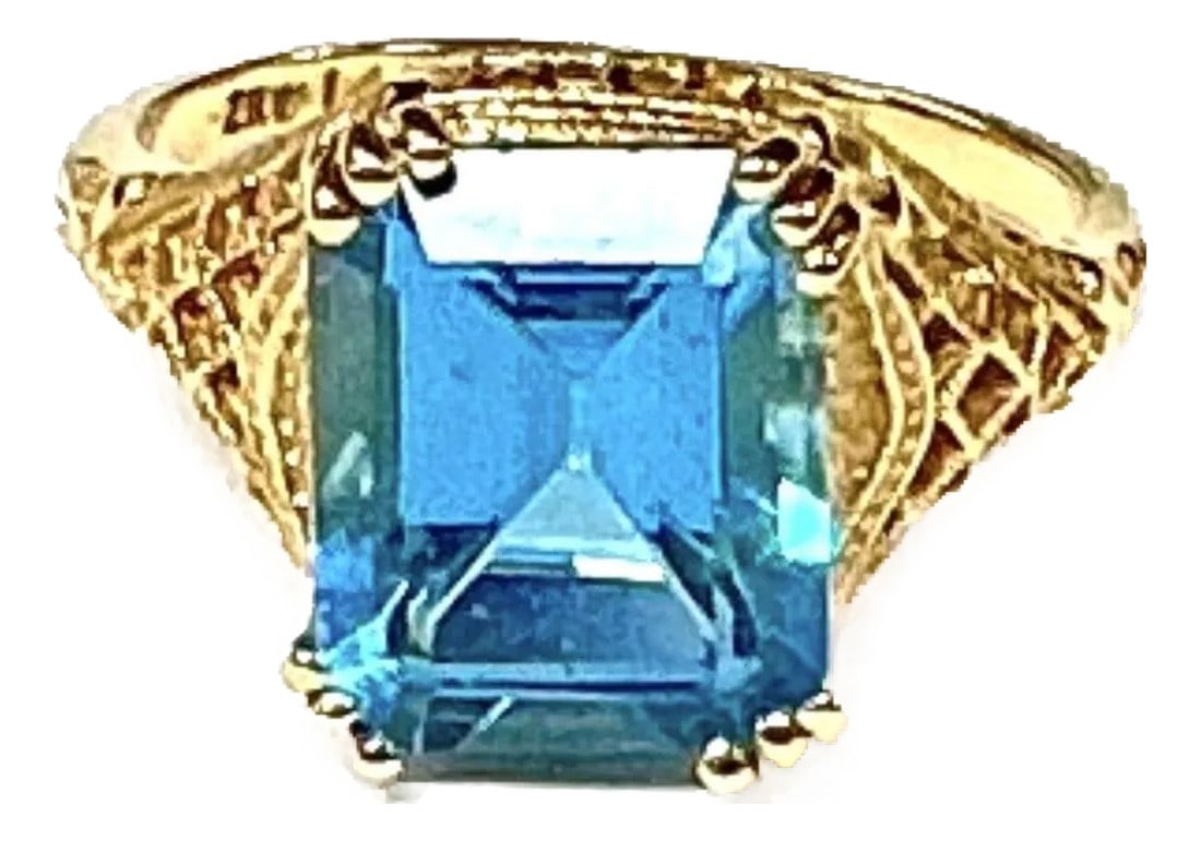 Blue Topaz 14k Yellow Gold Ring: 14k yellow gold Blue Topaz ring, 4.11 Grams TW. The dimensions of the approximately 11.5 mm x 8.5 mm. Marked 14k. Approximate size 7. Condition: Alterations: Original Condition Unaltered