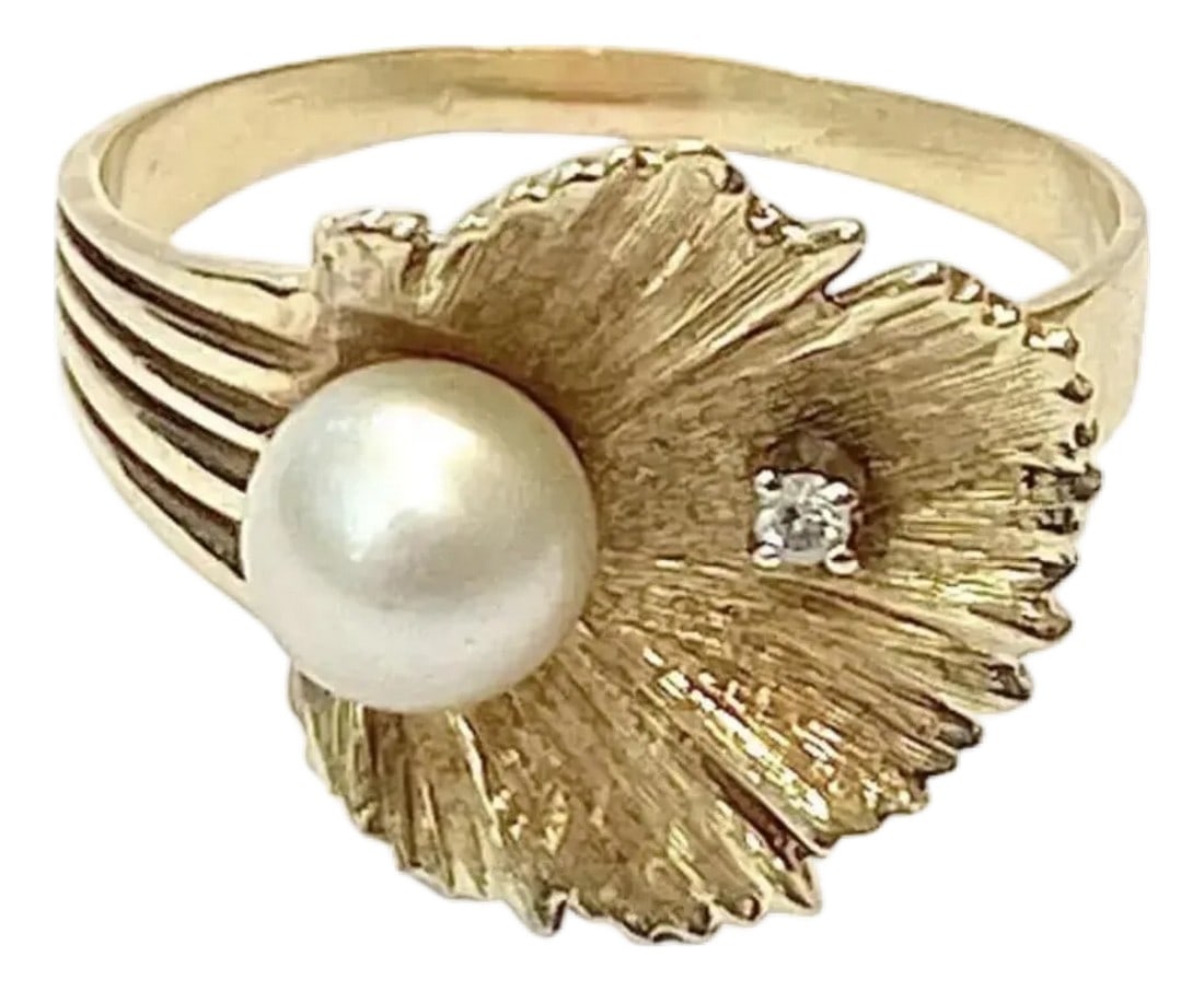Pearl and Diamond Ring 14k Gold: 14K Pearl And Diamond Ring. 14K yellow gold ring contains 1 round brilliant cut diamond. WEIGHT: .02 Ct. Approx. Rated SI in clarity and H-I in color. One 7.00 mm cultured pearl is epoxy set. the