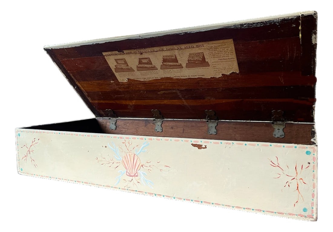 Early 20th Century Hand-Painted Large Seed Box With Seashell and Coral Motif: Bring a touch of coastal romance and rustic charm to your home with this early 20th century seed box, beautifully hand-painted in soft seaside tones. Originally crafted as a merchant's display box