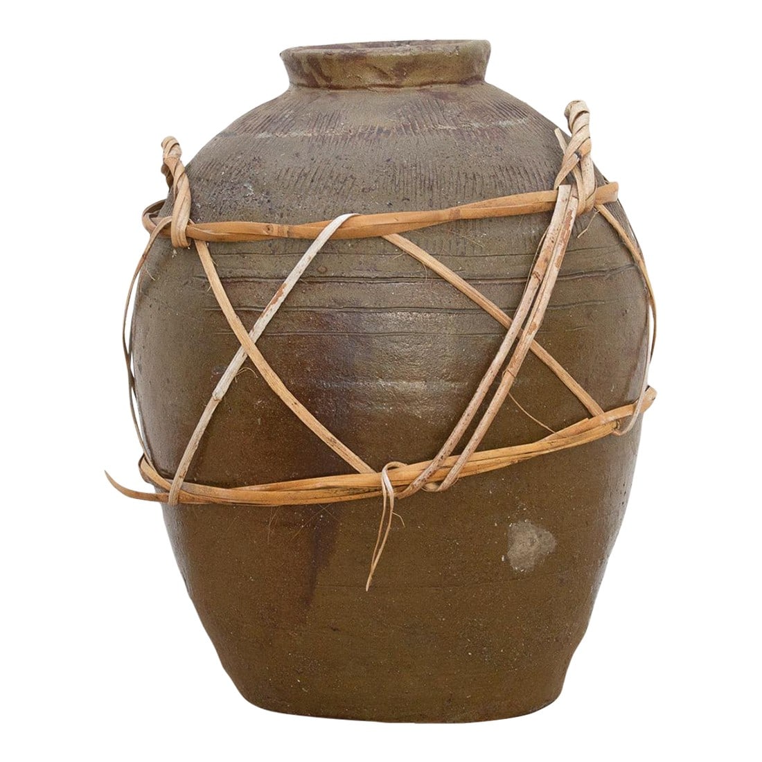 Antique Asian Stoneware Pot With Rattan Harness: This large stoneware jug is a testament to the enduring utility of traditional design and craftsmanship. Likely originating from a provincial kiln in Asia and dating to the 19th century, its robust fo