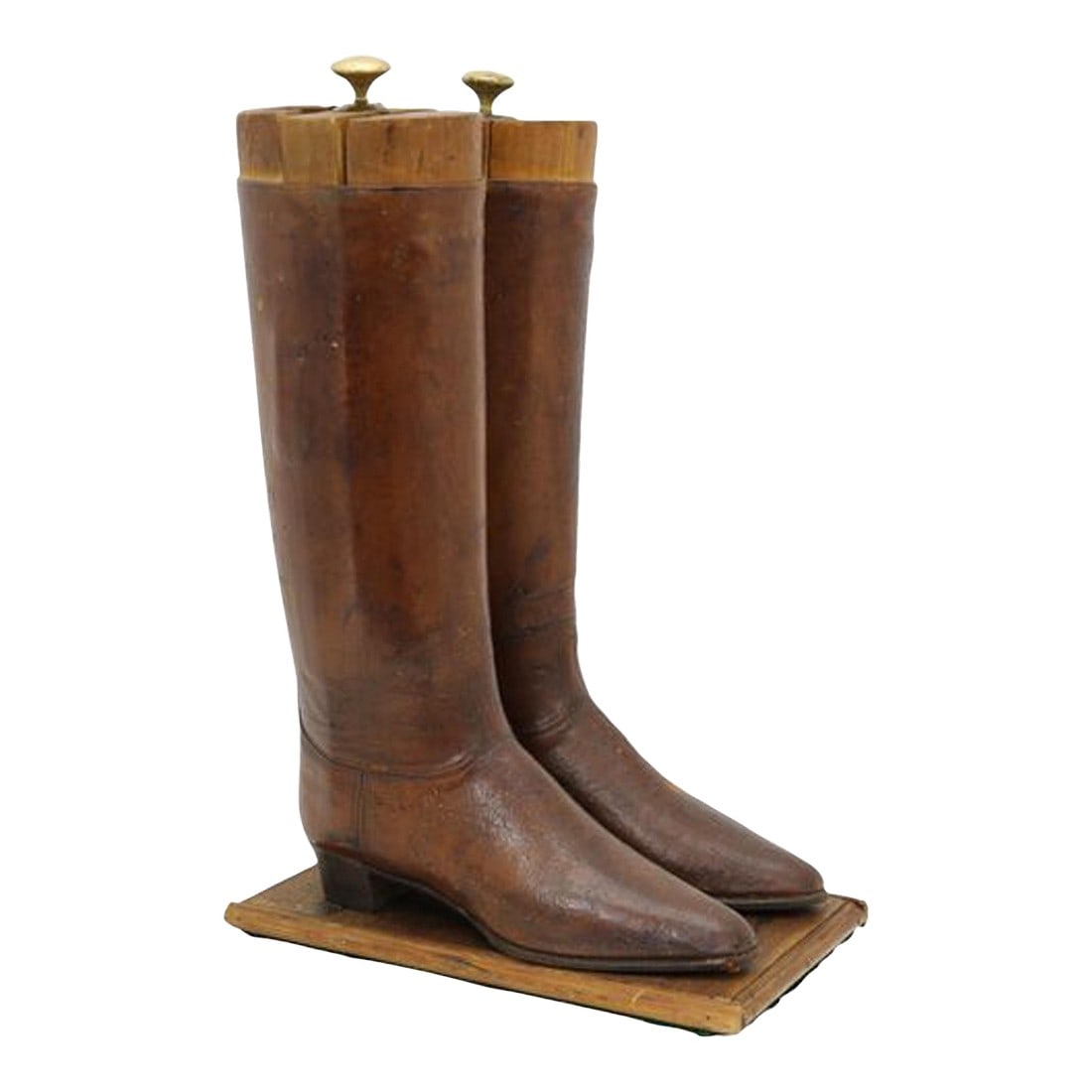 19th-Century English Riding Boot Shop Display: A rare English 19th-century riding boot shop display, custom made for a London leathersmith's boutique. Fashioned from genuine leather riding boots mounted on a custom wood base with fitted boot