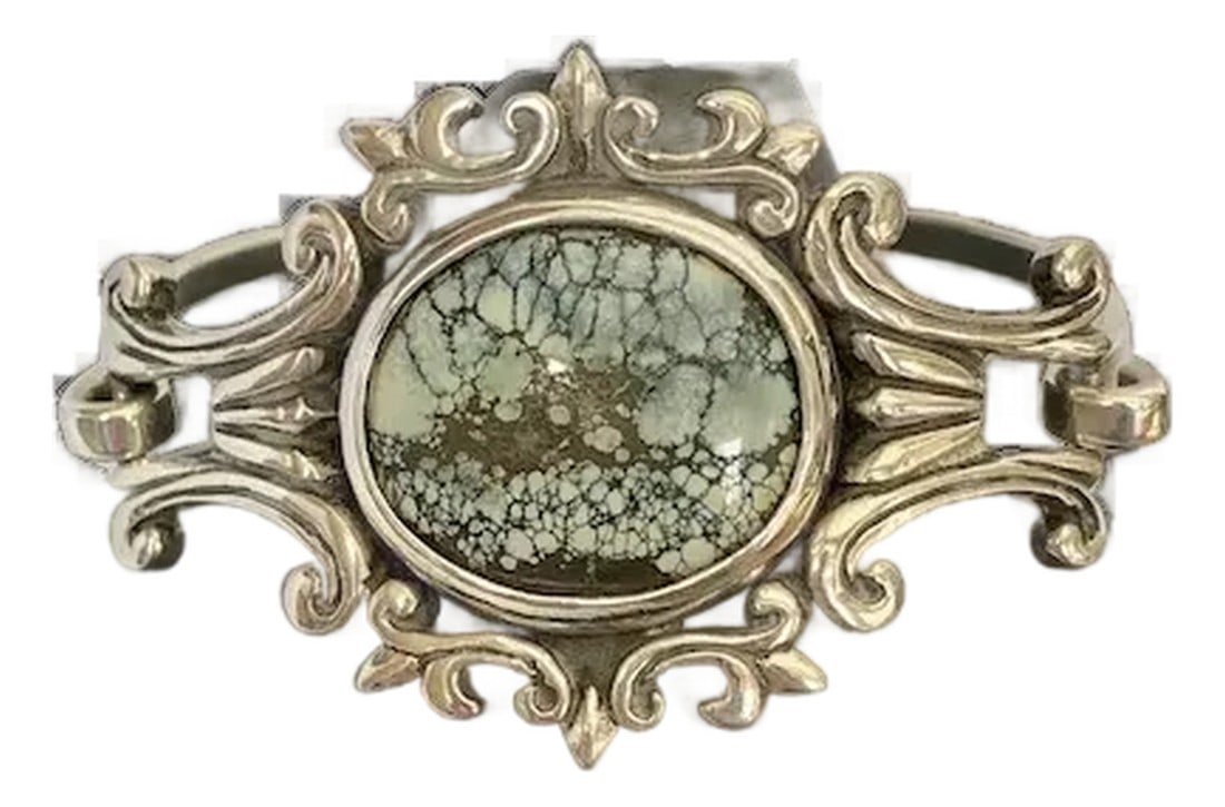 King Baby Sterling and Turquoise Bracelet: Gorgeous King Baby sterling and turquoise baroque style bracelet. This lovely and substantial piece has a front clasp so it looks seamless. Front measures 1 1/2" x 2 1/2". The bracelet is 6 1/2" in di