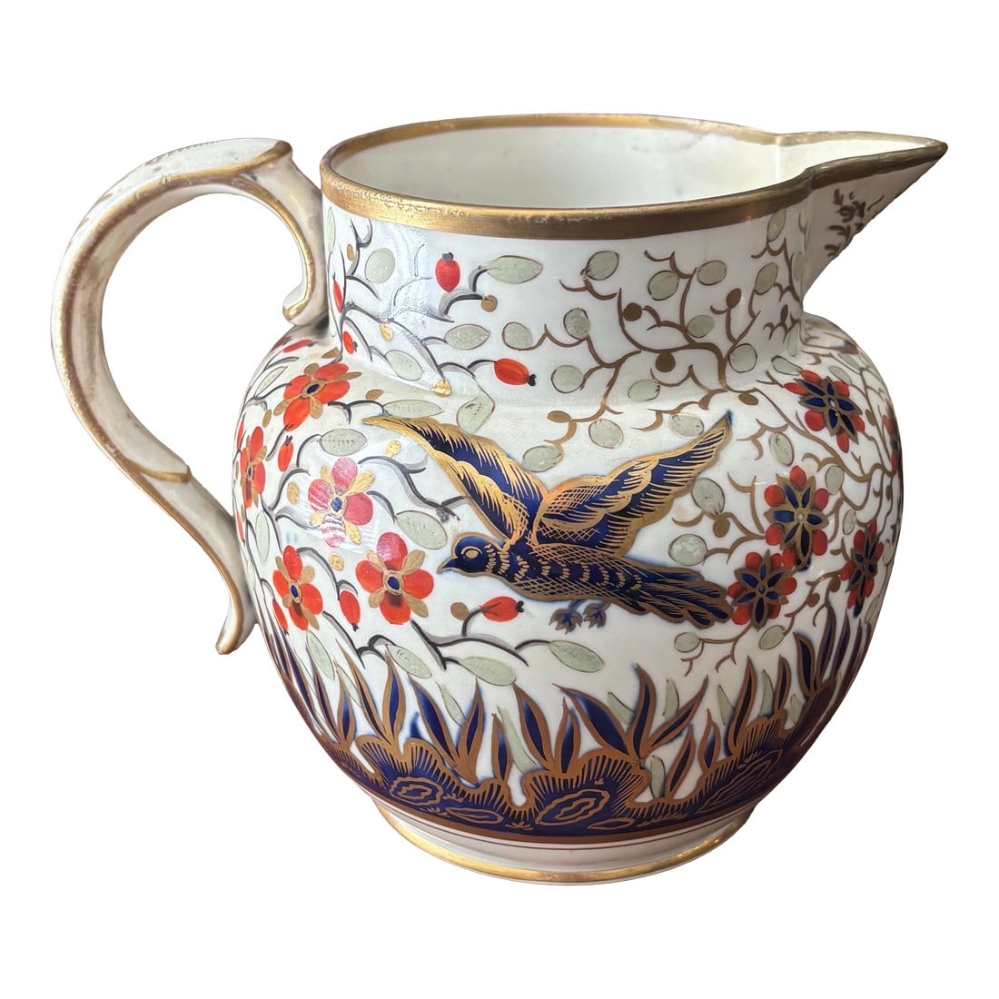 19th Century Imari Style Ironstone Pitcher: 19th century Imari ironstone pitcher, in traditional colors of blue, rust orange, and gold. With beautiful bird among branches and florals motif. Sourced from an avid collector of antique Imariware