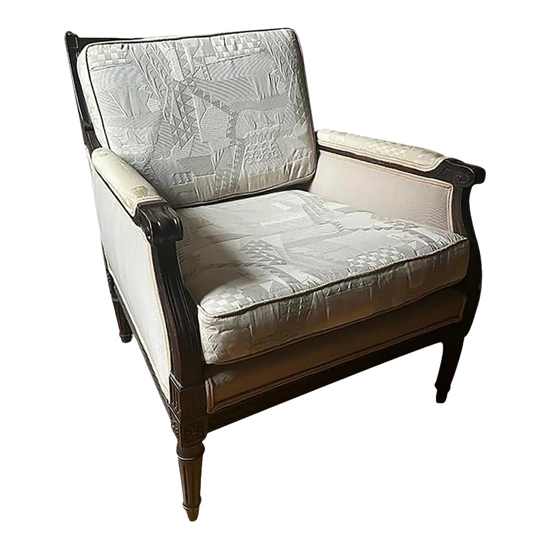 Early 20th Century Louis XVI Bergère Chair: Early 20th century Louis"¯XVI bergère chair with a carved dark wood frame and classic proportions. The chair retains its traditional form and exposed wood structure typical of the period.