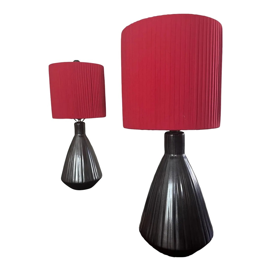 Pair of 1980s Postmodern Ceramic Lamps With Custom Red Pleated Shades: Pair of postmodern ceramic table lamps from the 1980s. They feature fluted ceramic bases with a dense, sculptural form, finished in a dark neutral glaze .Each lamp is fitted with a red pleated fabric