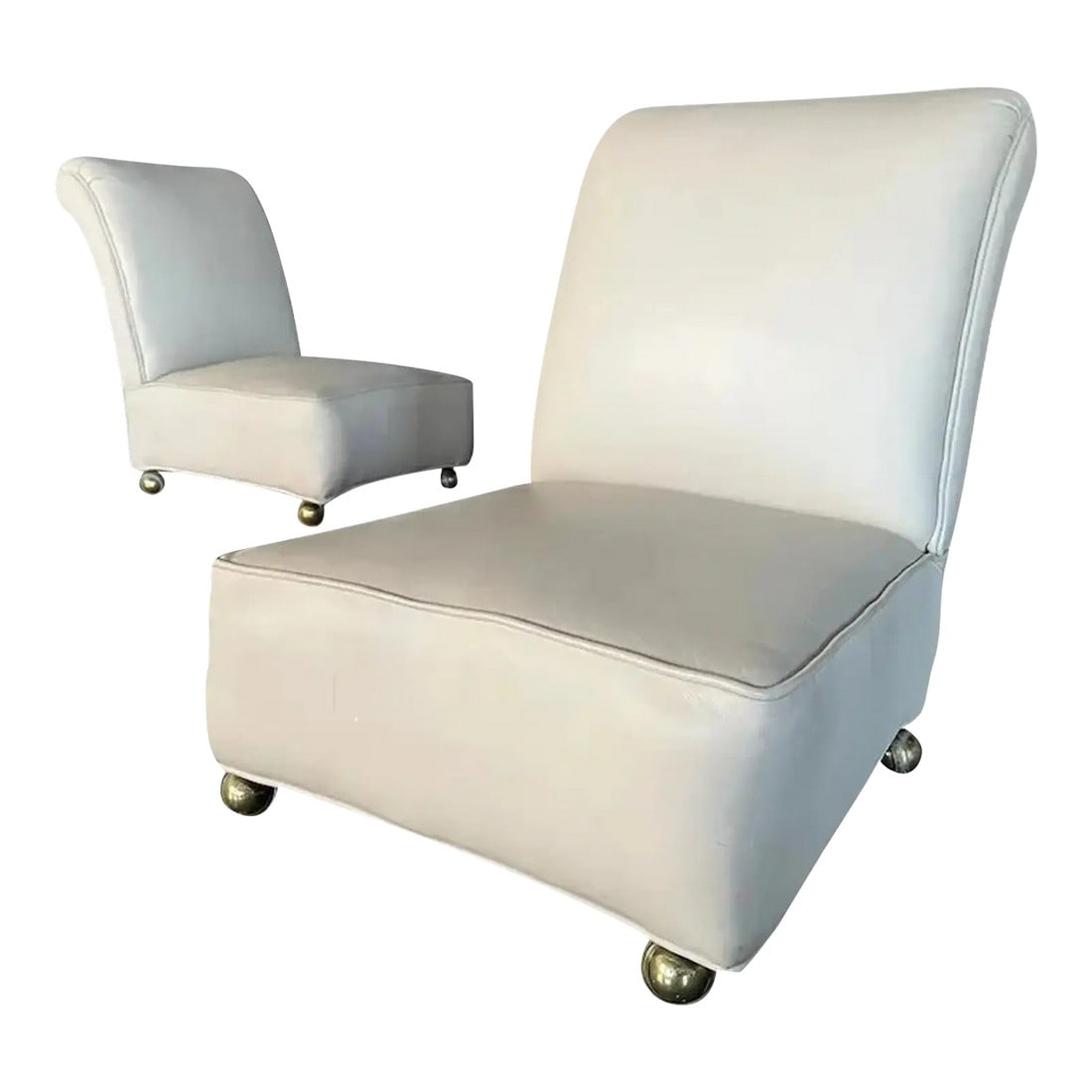 1950s Mid-Century Modern, Italian Leather Slipper Chairs Circa 1950s: A pair of 1950s Italian Mid-Century Modern slipper chairs, reupholstered in white leather in the 1970s. These armless chairs feature a low-slung profile, gently curved backs, and brass ball casters fo