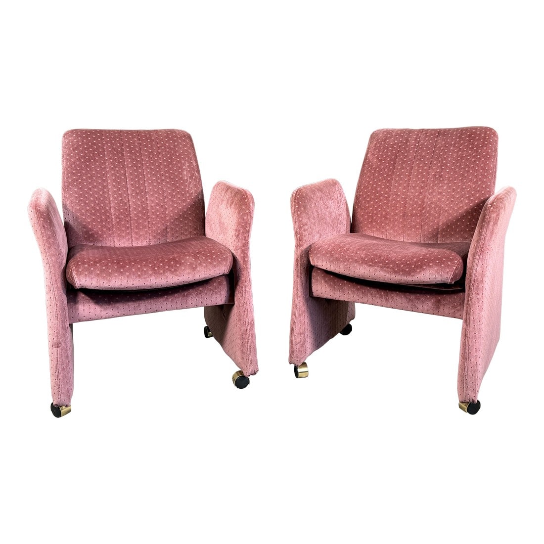 Vintage Mid Century Modern Chromcraft Velvet Upholstered Armchairs Pink Dot Pattern- A Pair: This pair of Chromcraft upholstered armchairs features a sculptural low profile form with softly curved arms, a tall padded back, and brass tone rolling casters, all upholstered in a dusty rose velvet