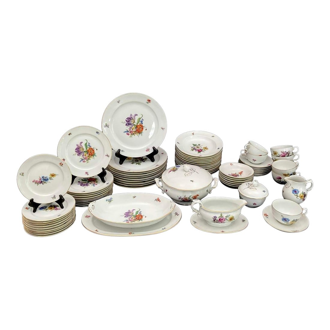 1980s Exceptional Set of Furstenberg "Ancestral Dresden" China - 71 Pieces: Exceptional set of Furstenberg "Ancestral Dresden" China - 71 pieces White china with center vibrant floral bouquet and floral motif to rim with gold trim. Made in Germany. Vintage, discontinued