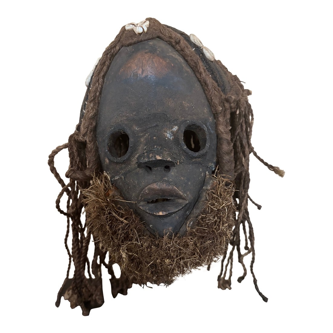 African Dan Mask. 20th Century: Antique Dan Mask from the Ivory Coast. 20th century. Shows signs of aging on the patina. Made of wood , fiber , textiles and cowrie shells. Black in color Measures 10 inches hight and 7 inches wide. P