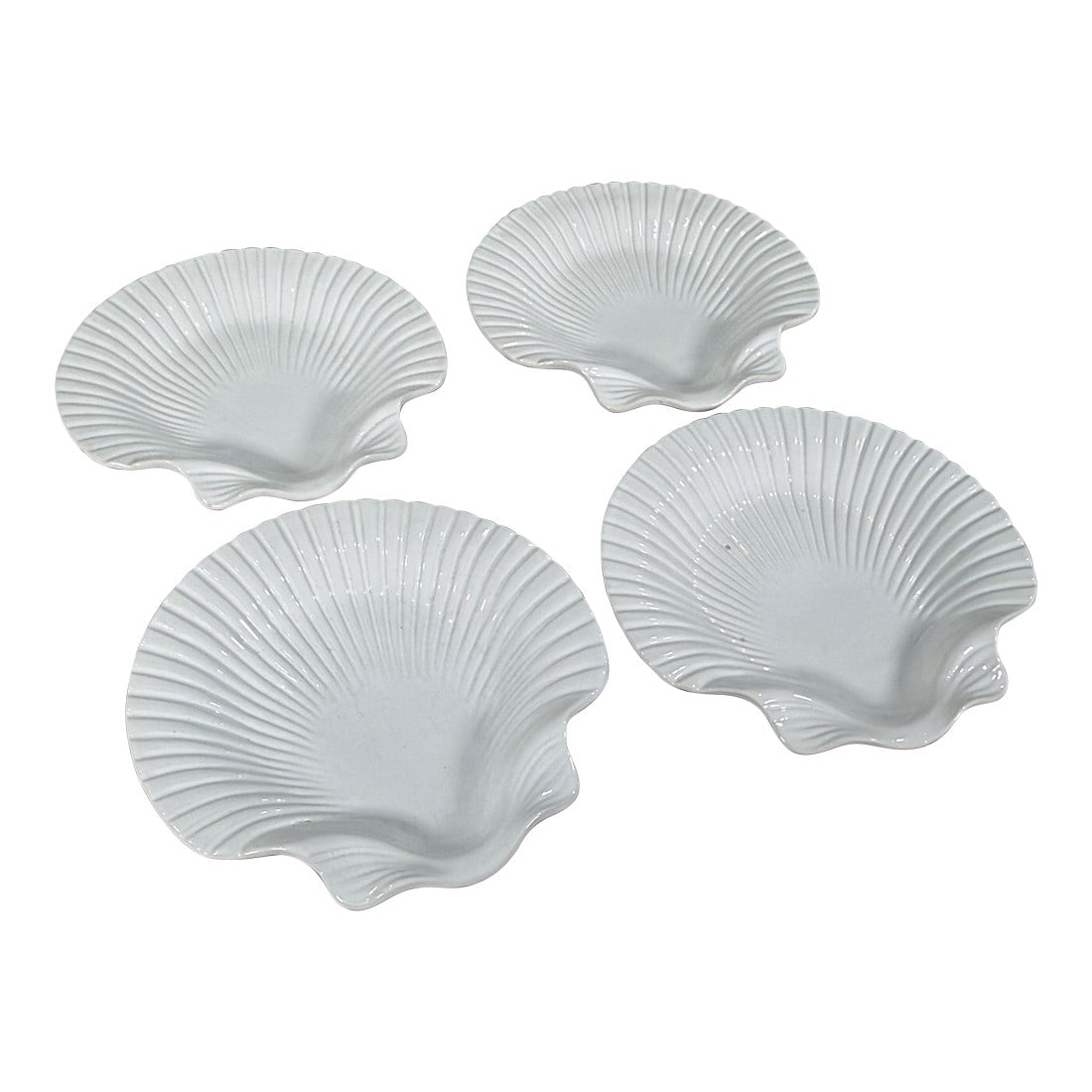 Williams Sonoma Portugal White Ceramic Scallop Shell Plates - Set of 4: This set of four white ceramic plates was made in Portugal for Williams Sonoma. Each plate is molded in the form of a scallop shell with radiating ribbed detailing from the center. The pieces feature 
