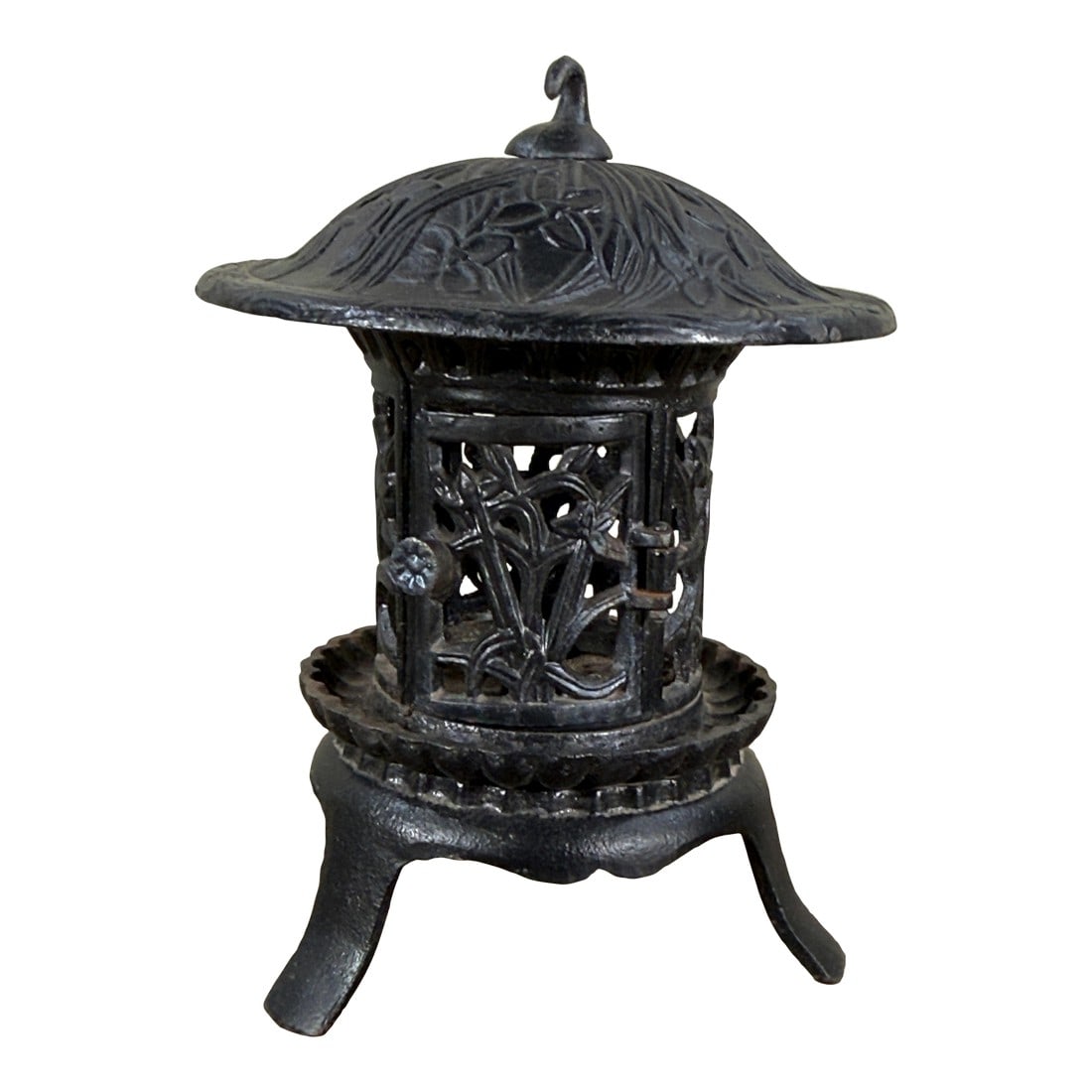 Chinese Cast Iron Garden Lantern With Hanging Finial and Iris Relief: This Chinese cast iron garden lantern features a cylindrical body with openwork panels depicting iris flowers and foliage. The piece is topped with a curved roof decorated with relief carved