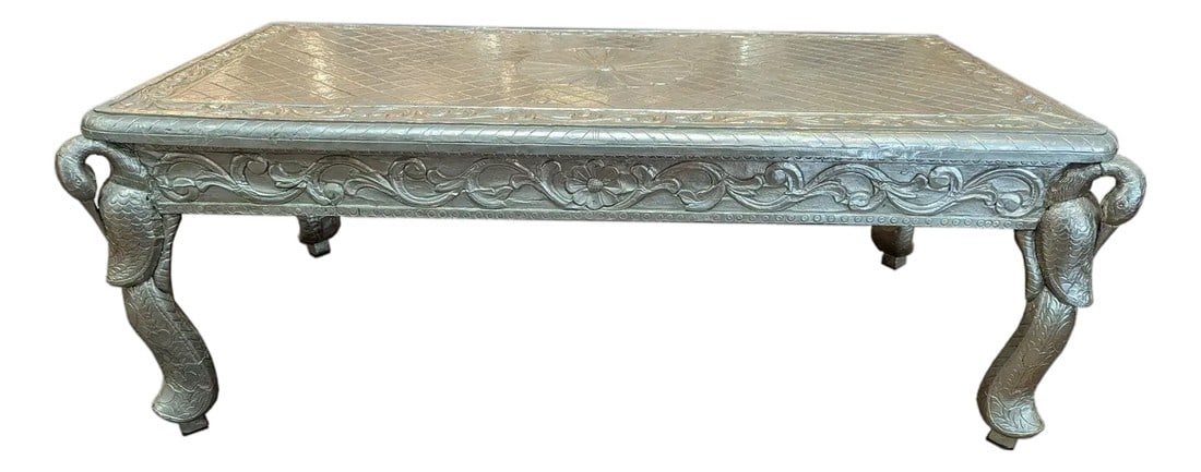 Mid 20th Century Luxury Hand Carved German Silver Coffee Table | Ornate Peacock Maharaja Center Tabl: Step into a world of regal splendor with this breathtaking Vintage Hand Carved Metal Cladded Silver Maharaja Coffee Table. This exceptional centerpiece is more than just furniture; it is a storied