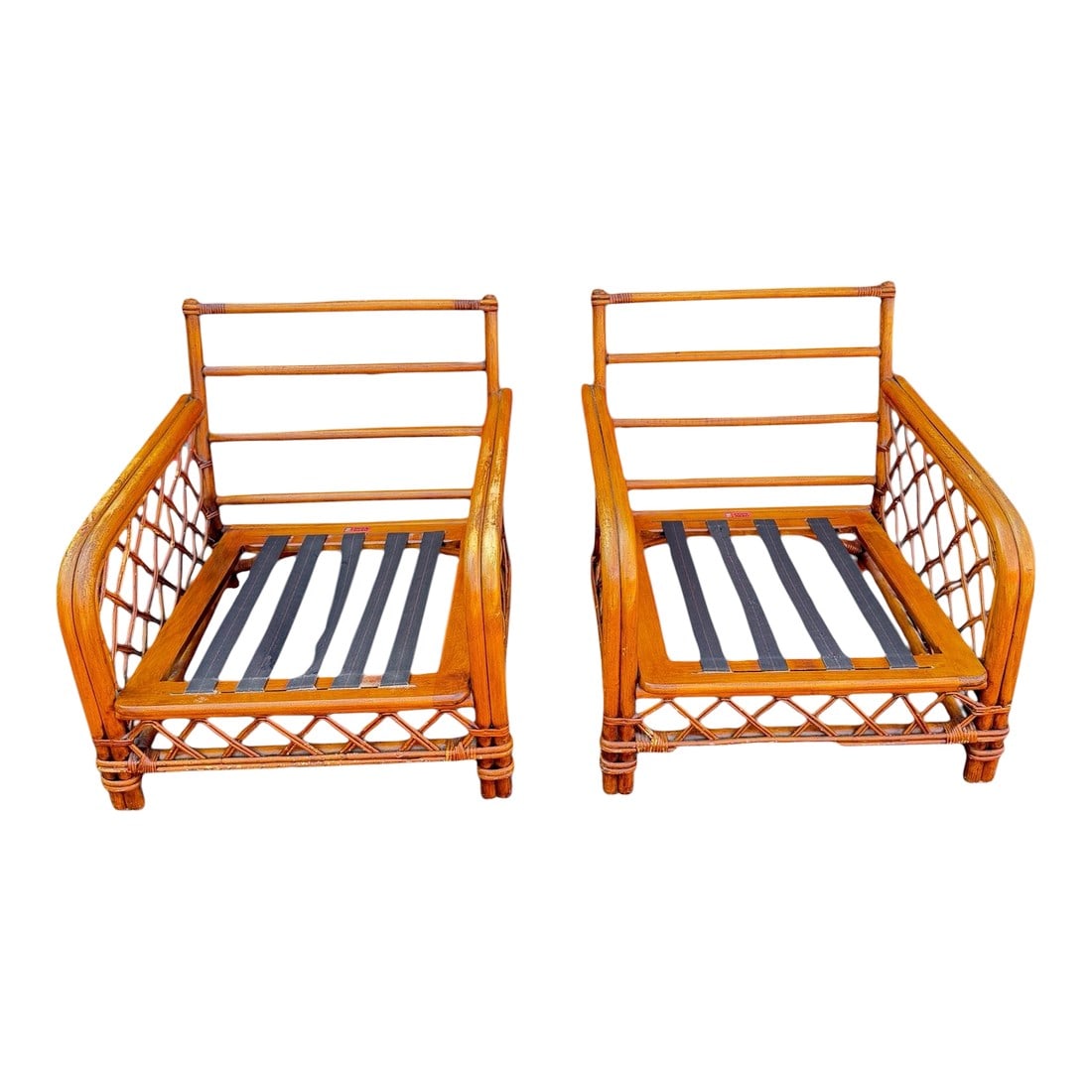 Pair of Vintage Ficks Reed Rattan Lounge Chair Frames With Lattice Sides: A stylish pair of vintage Ficks Reed rattan lounge chair frames featuring classic lattice side panels, wrapped joints, and a warm honey-toned finish. These timeless frames showcase the craftsmanship