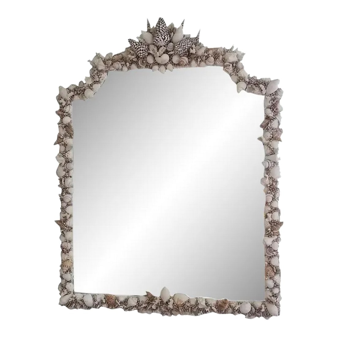 Handmade Natural Sea Shell Encrusted Wall Mirror: Crafted with meticulous attention to detail, this vintage plate mirror is adorned with an array of textural, organic seashells and corals. Inspired by the serene palette of New England, I