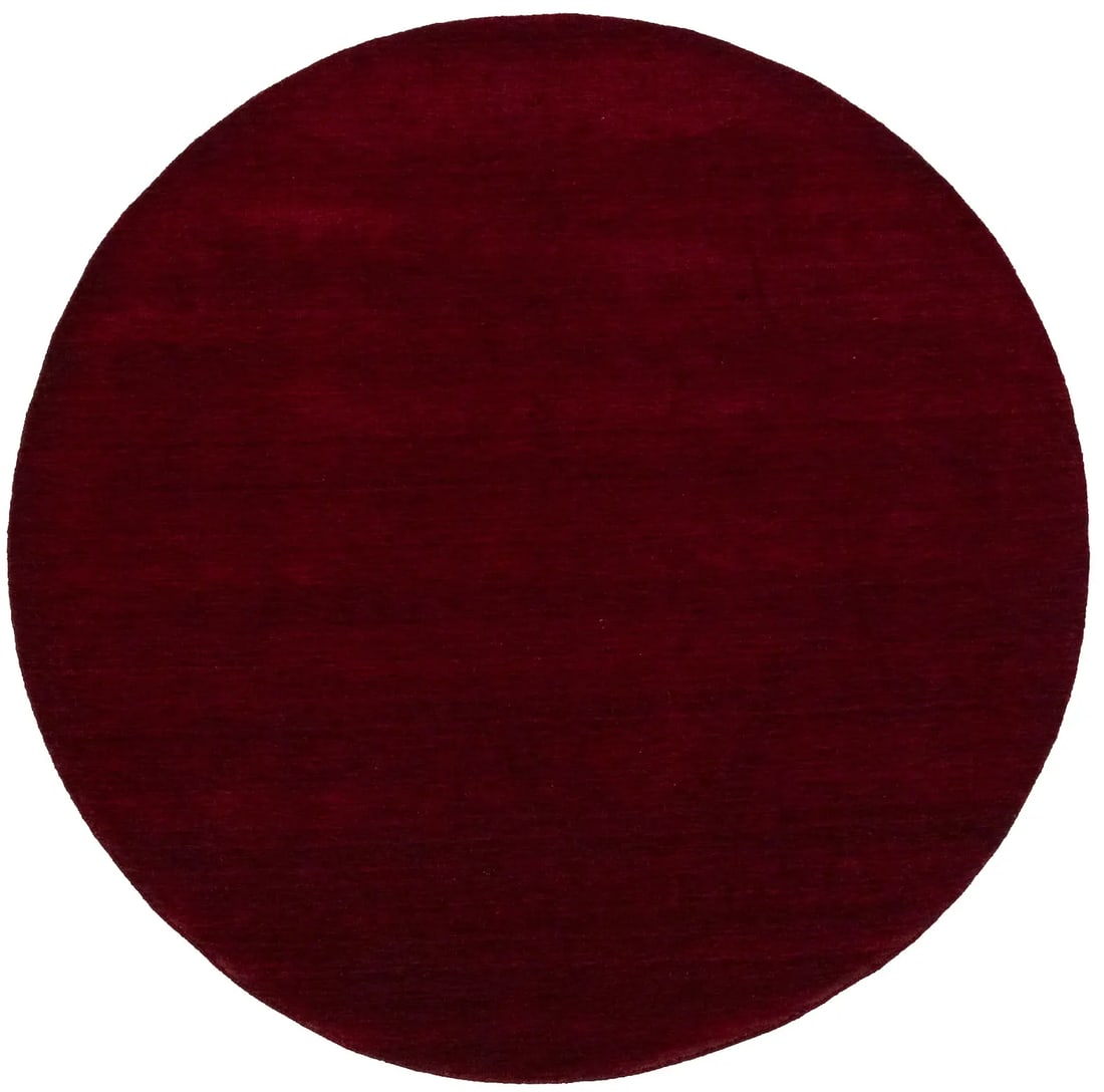 Maroon Red Modern Solid 8X8 Gabbeh Oriental Round Rug: Title: Maroon Red Modern Solid 8X8 Gabbeh Oriental Round Rug Description:This hand-loomed 8X8 Maroon Red Oriental Round rug from India is characterized by a robust modern design and a rich Maroon Red